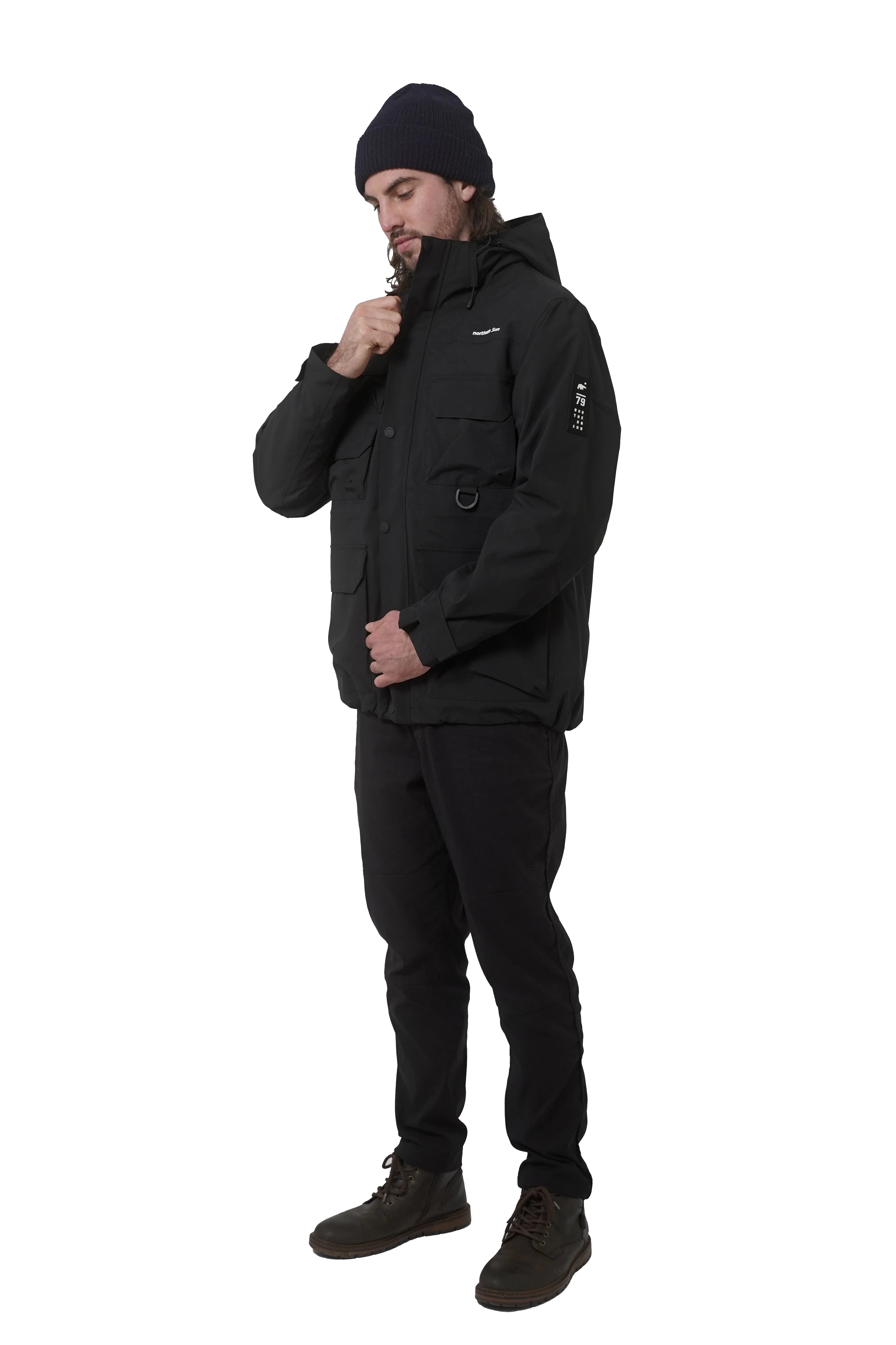 Man wearing Northern Sun men's 3-in-1 black parka with cargo pockets and beanie