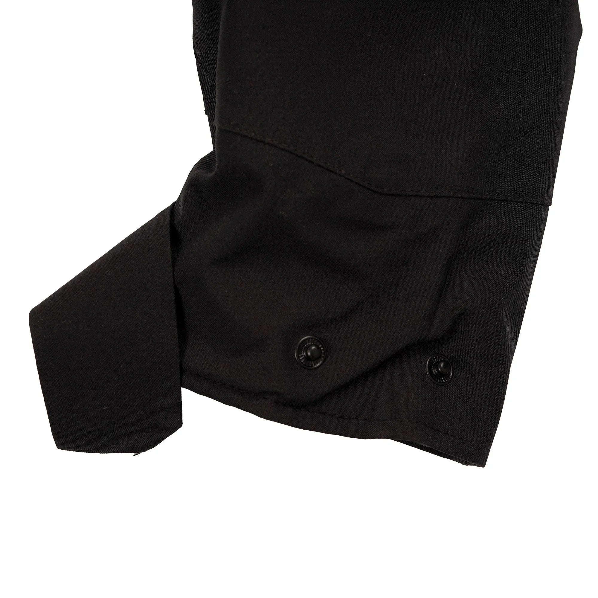 Black jacket sleeve with snap button cuff detail, close-up on white background
