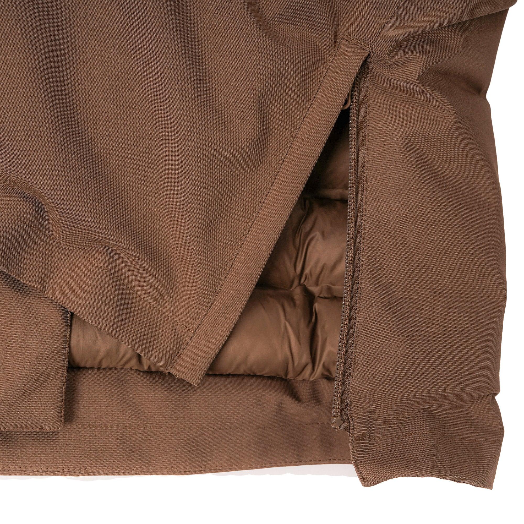 Close-up of brown insulated jacket with exposed zipper and quilted lining