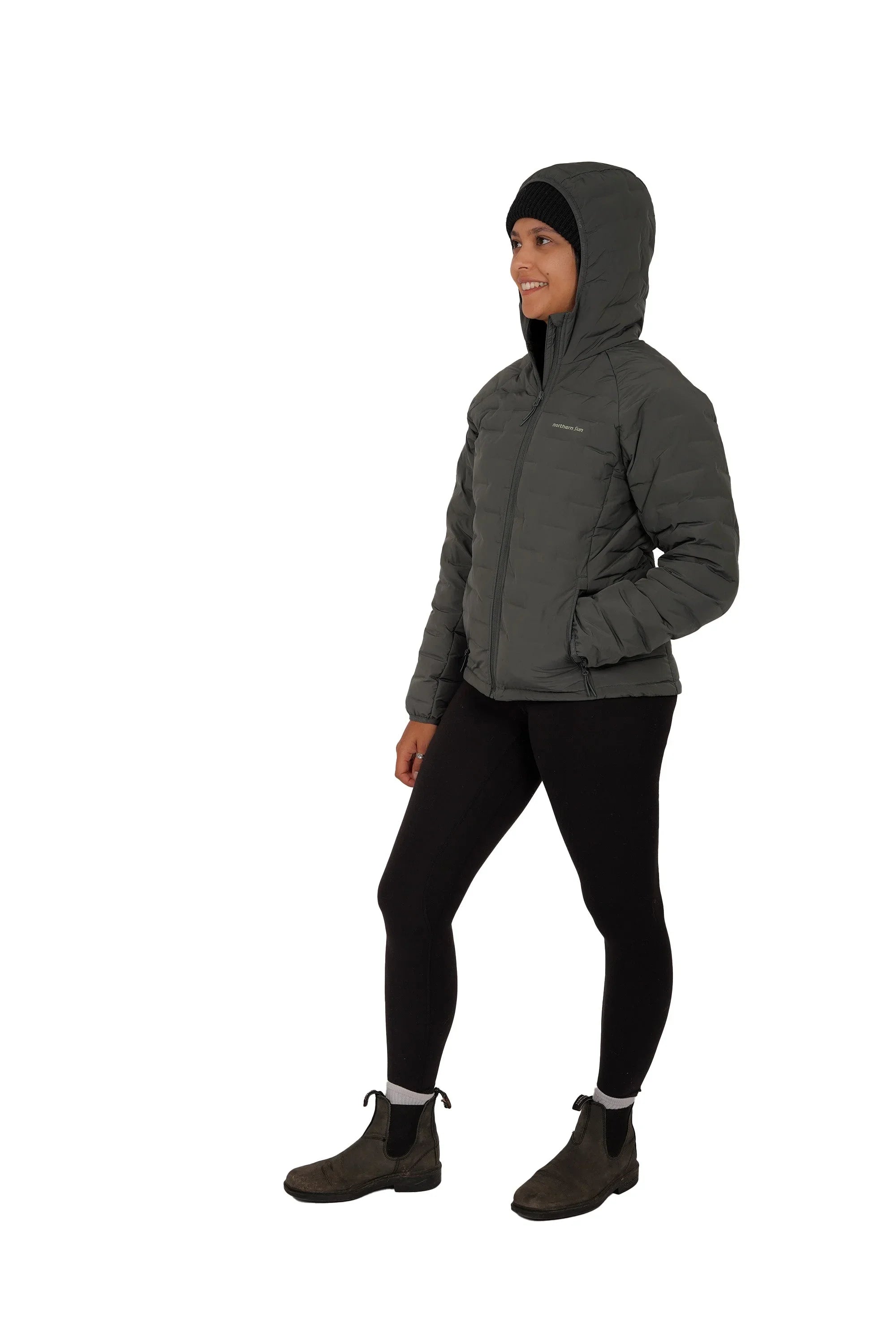 Woman wearing Northern Sun women's Dawson lightweight down jacket with hood, side view