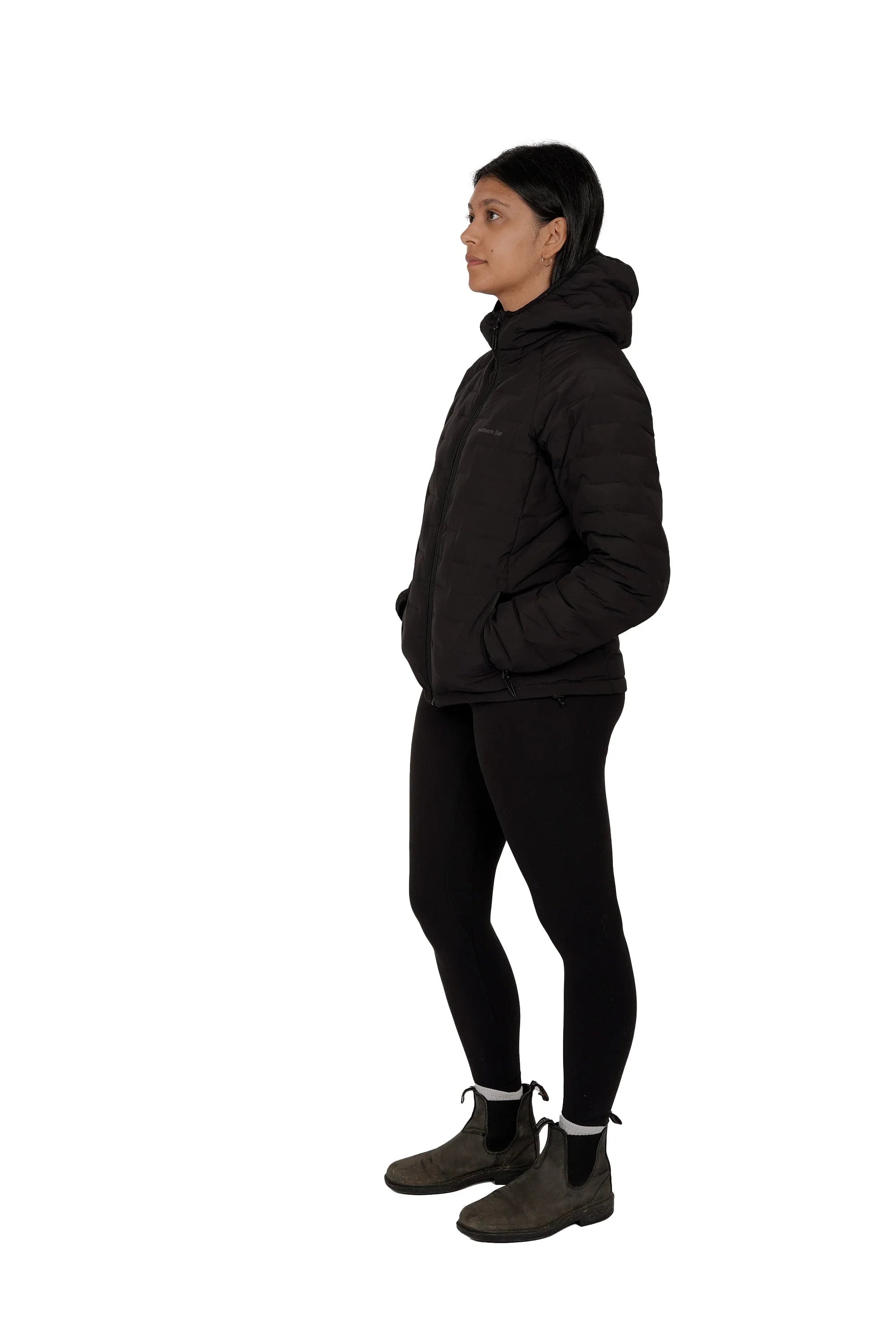 Woman modeling black lightweight down jacket with hood, side view, white background