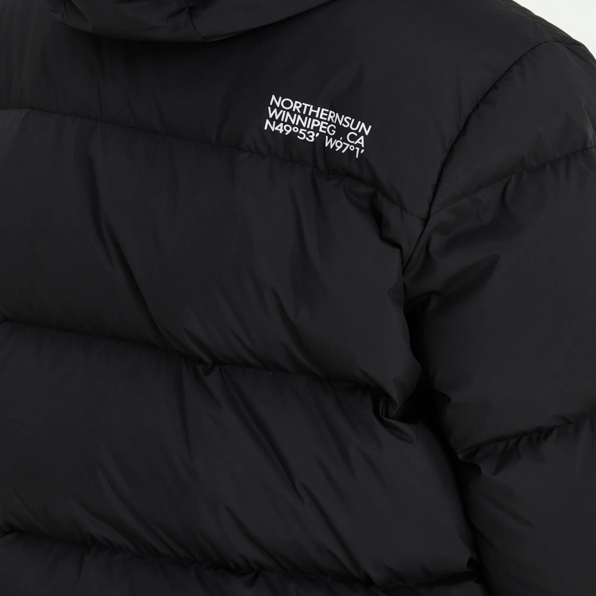 Northern Sun black men's down parka detail with Winnipeg logo and coordinates