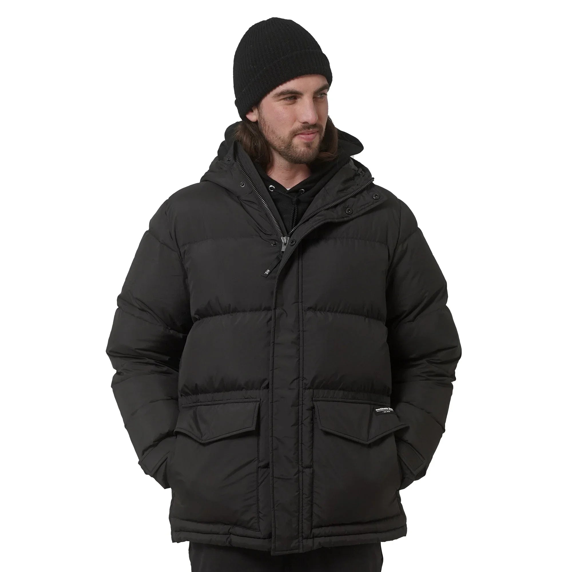 Man wearing black Northern Sun men's winter down parka and knit beanie, front view