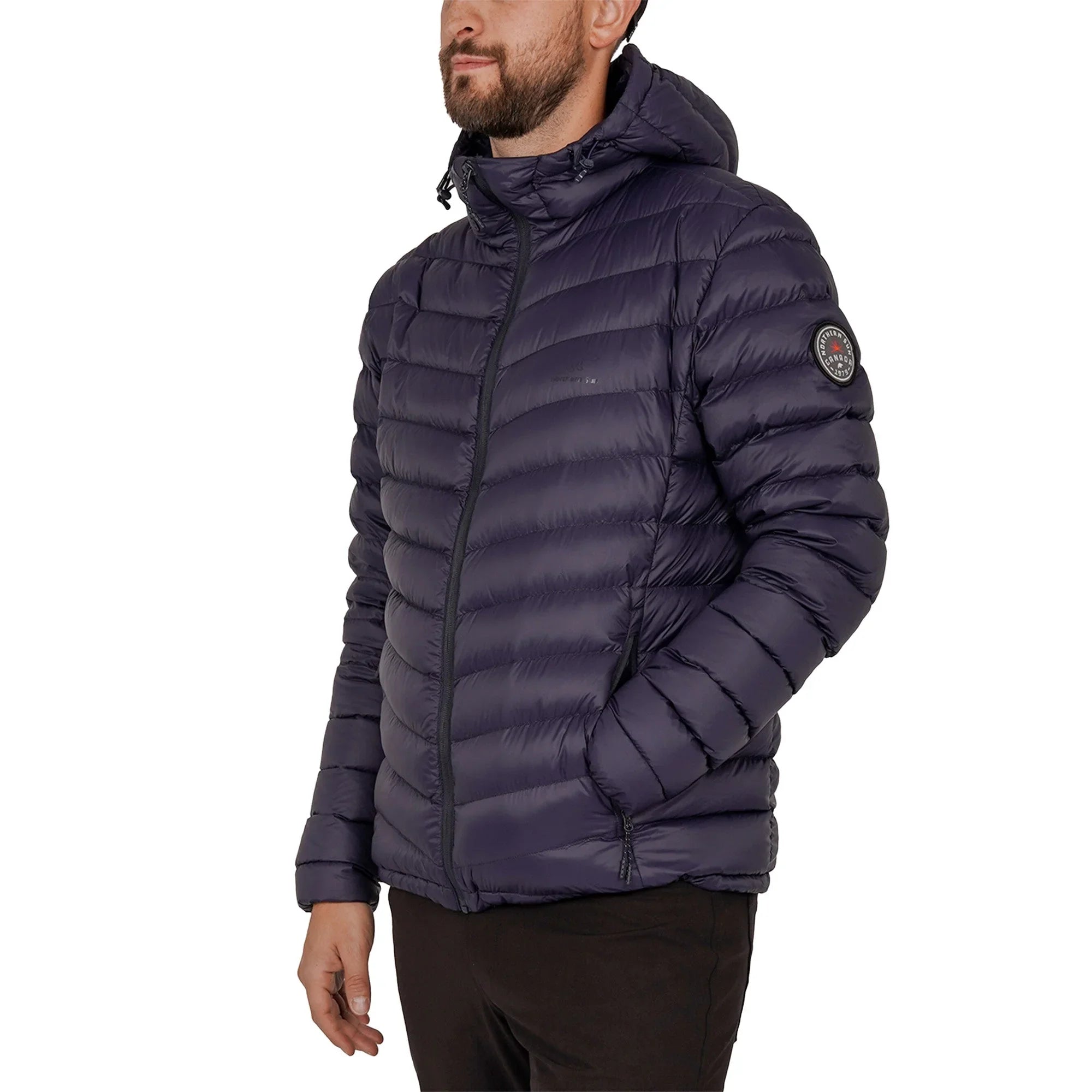Man wearing navy lightweight packable down jacket with logo patch on sleeve