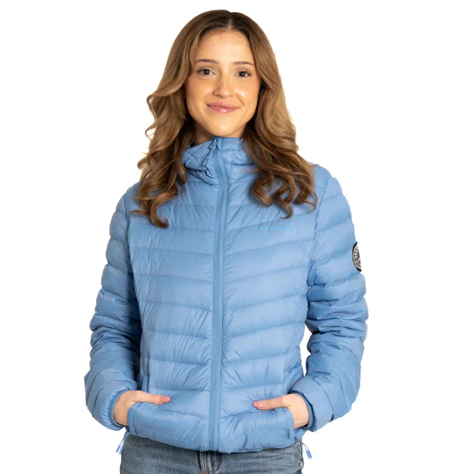 Woman wearing light blue packable puffer jacket with patch logo on sleeve