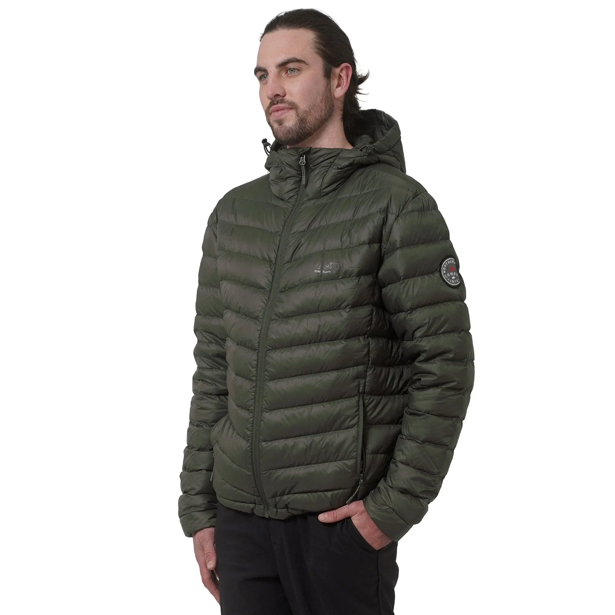 Man wearing olive green puffer jacket with hood on white background