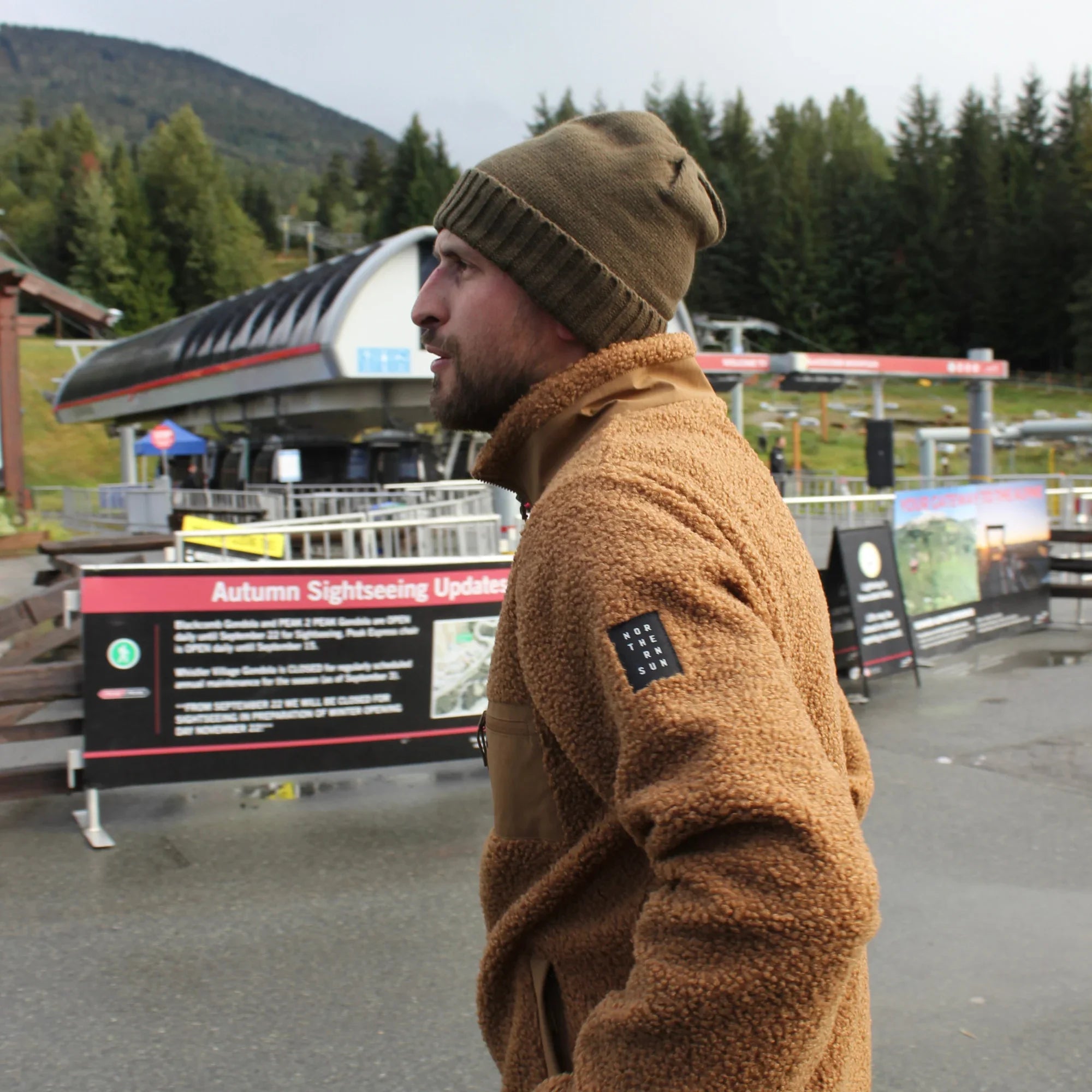 Man in Northern Sun men's teddy fleece jacket at Whistler Mountains ski lift