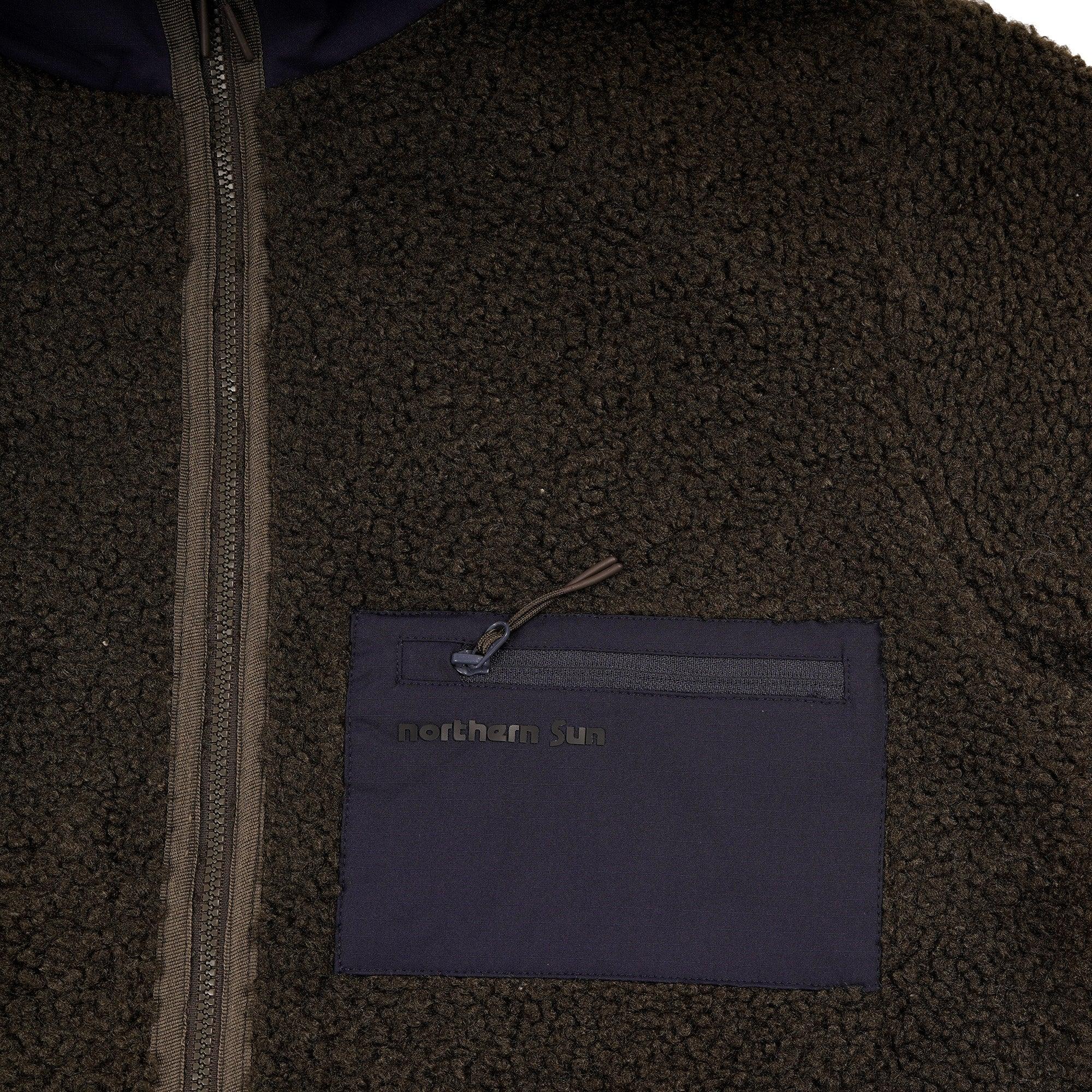 Northern Sun men's teddy fleece jacket close-up with navy zip pocket and textured fabric