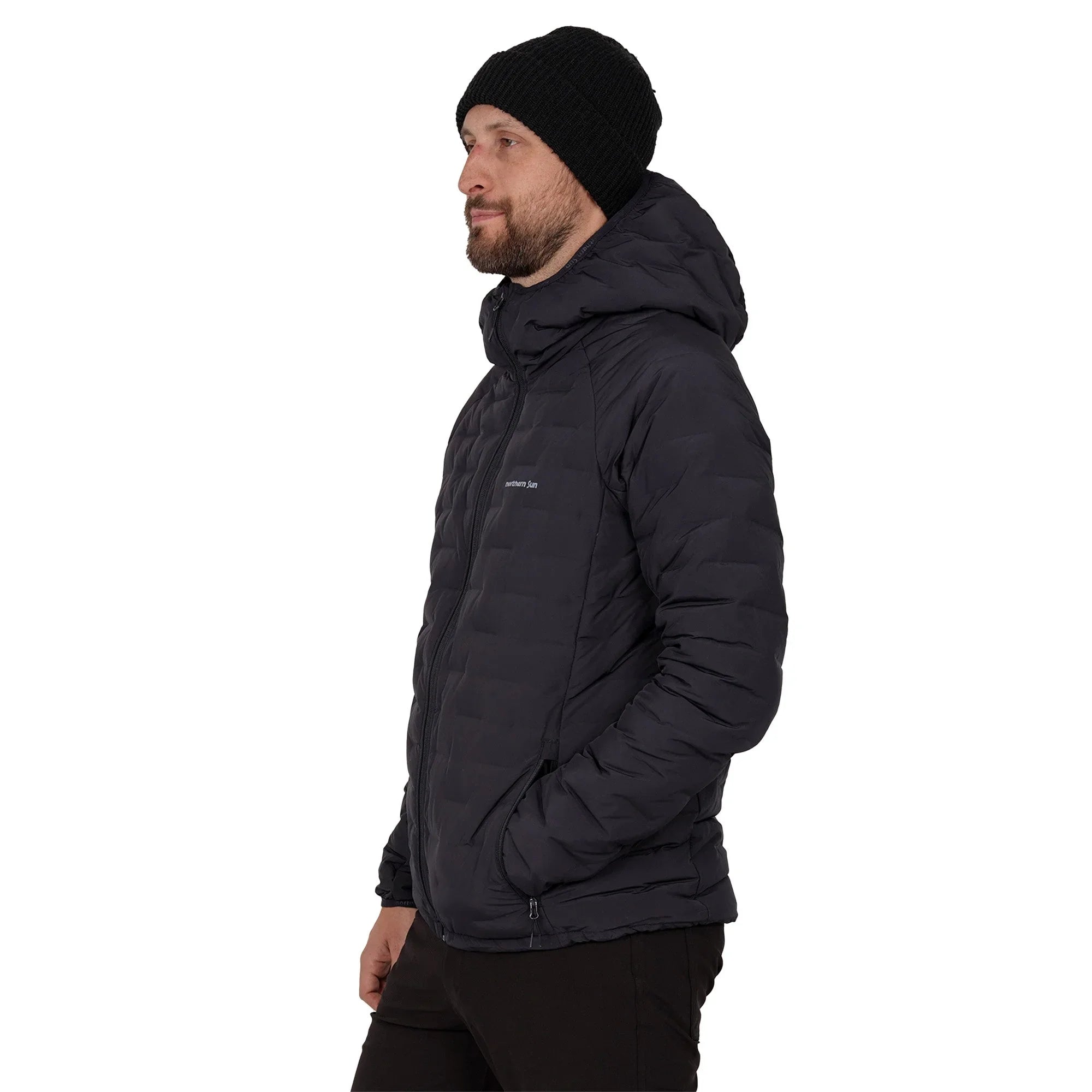 Man wearing navy Northern Sun Dawson down jacket and black knit beanie, side view