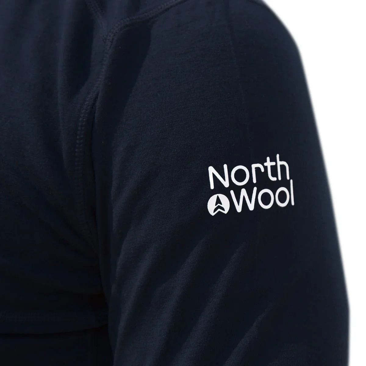 Close-up of North Wool logo on navy merino wool men's hoodie sleeve