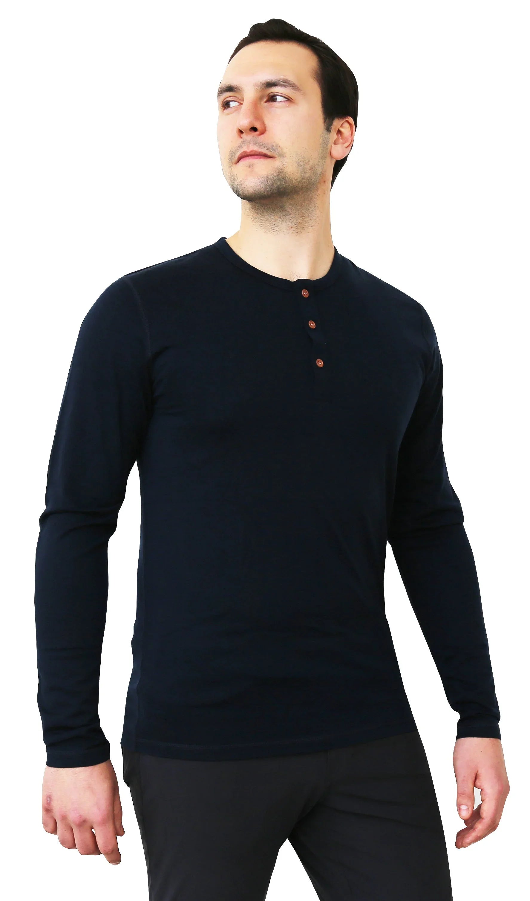 Man wearing black merino wool long sleeve Henley base layer shirt on white background