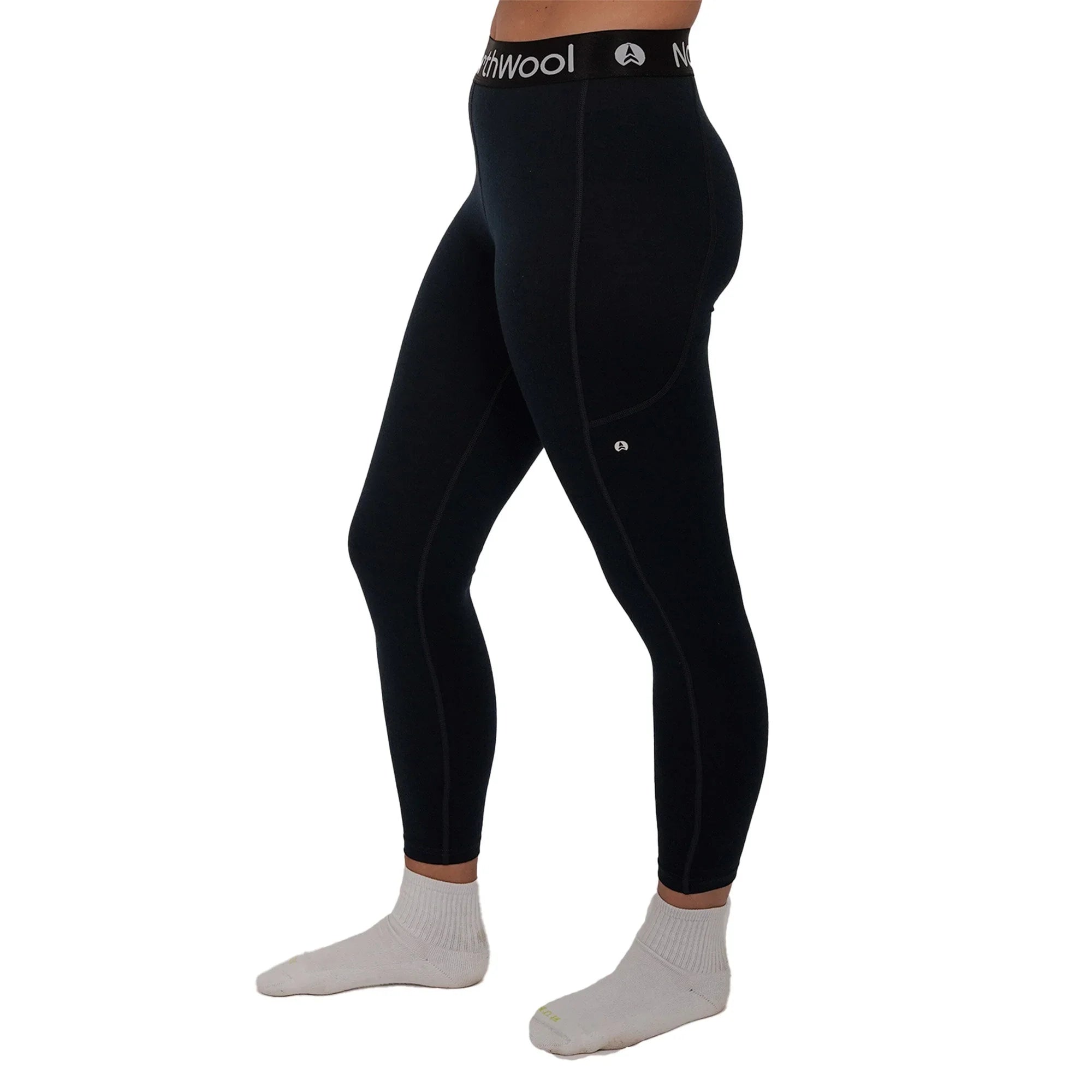Black merino wool leggings with logo waistband, side pocket, and white socks on a model