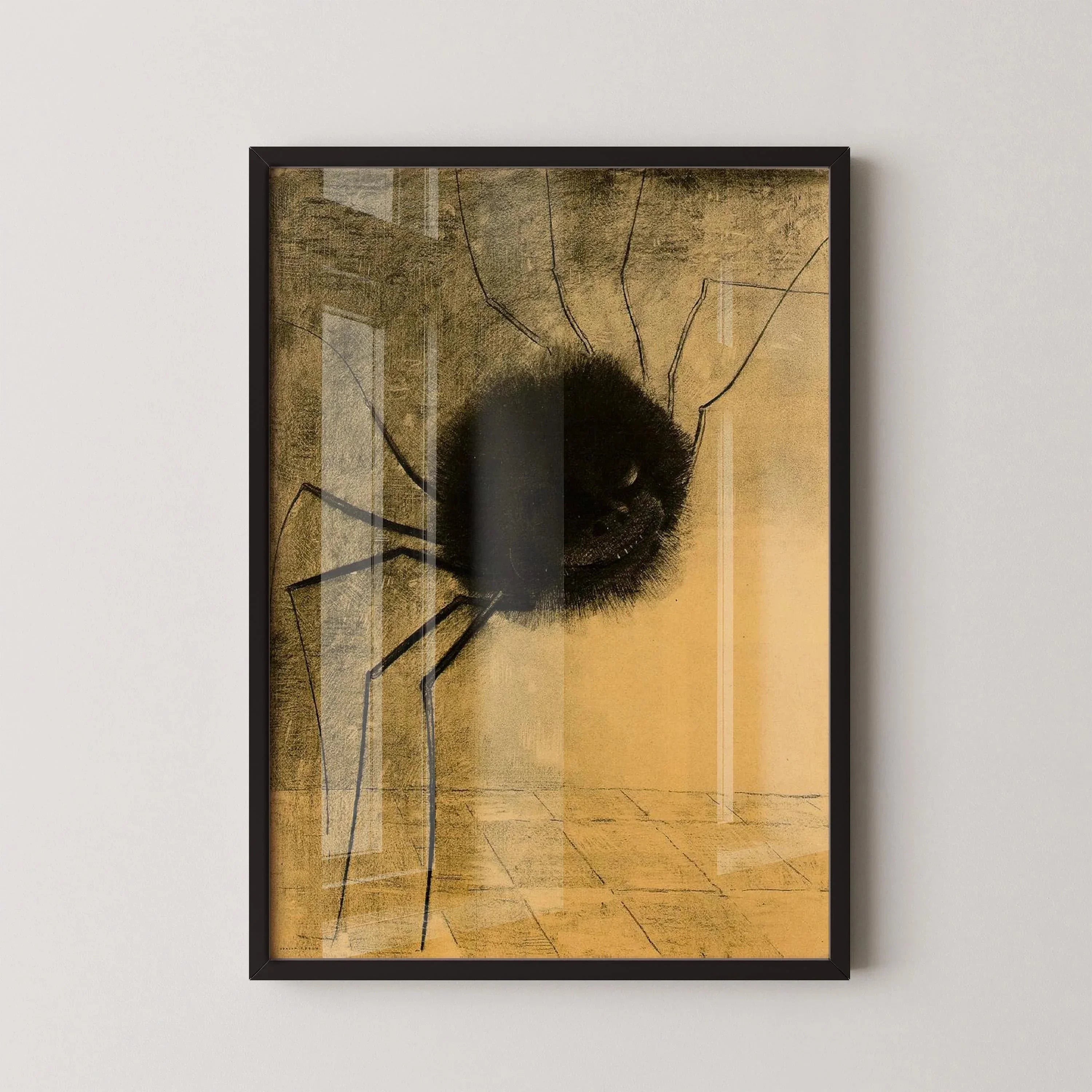 Framed print of a surreal spider with a human-like smiling face on a yellow background.