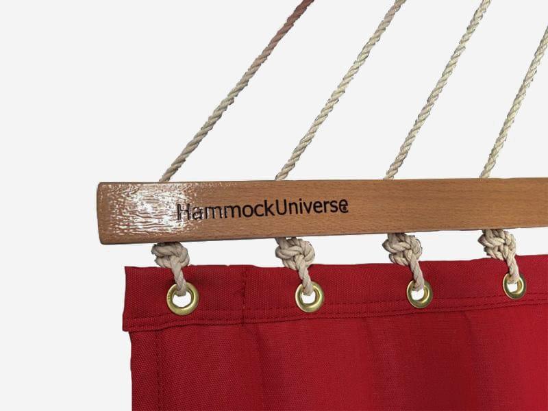 Red olefin double hammock with wooden spreader bar and rope suspension, HammockUniverse logo