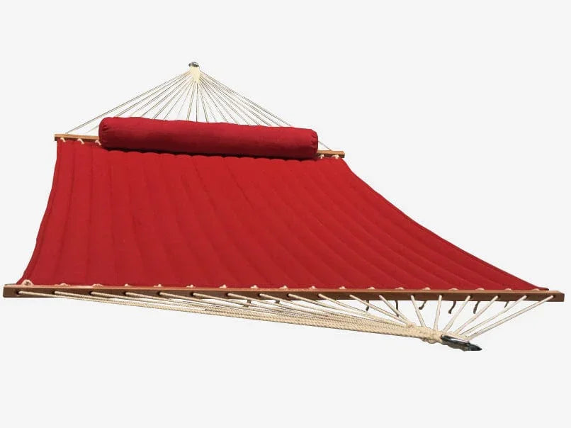 Red double olefin hammock with wooden spreader bars and pillow on white background