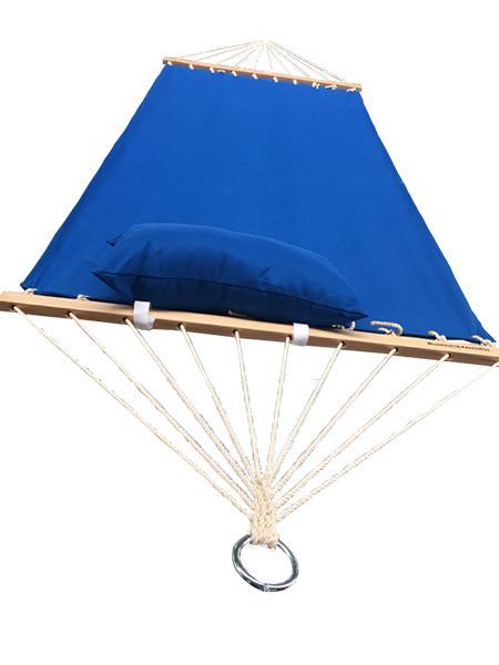 Blue olefin hammock with matching pillow and wooden spreader bar on white background