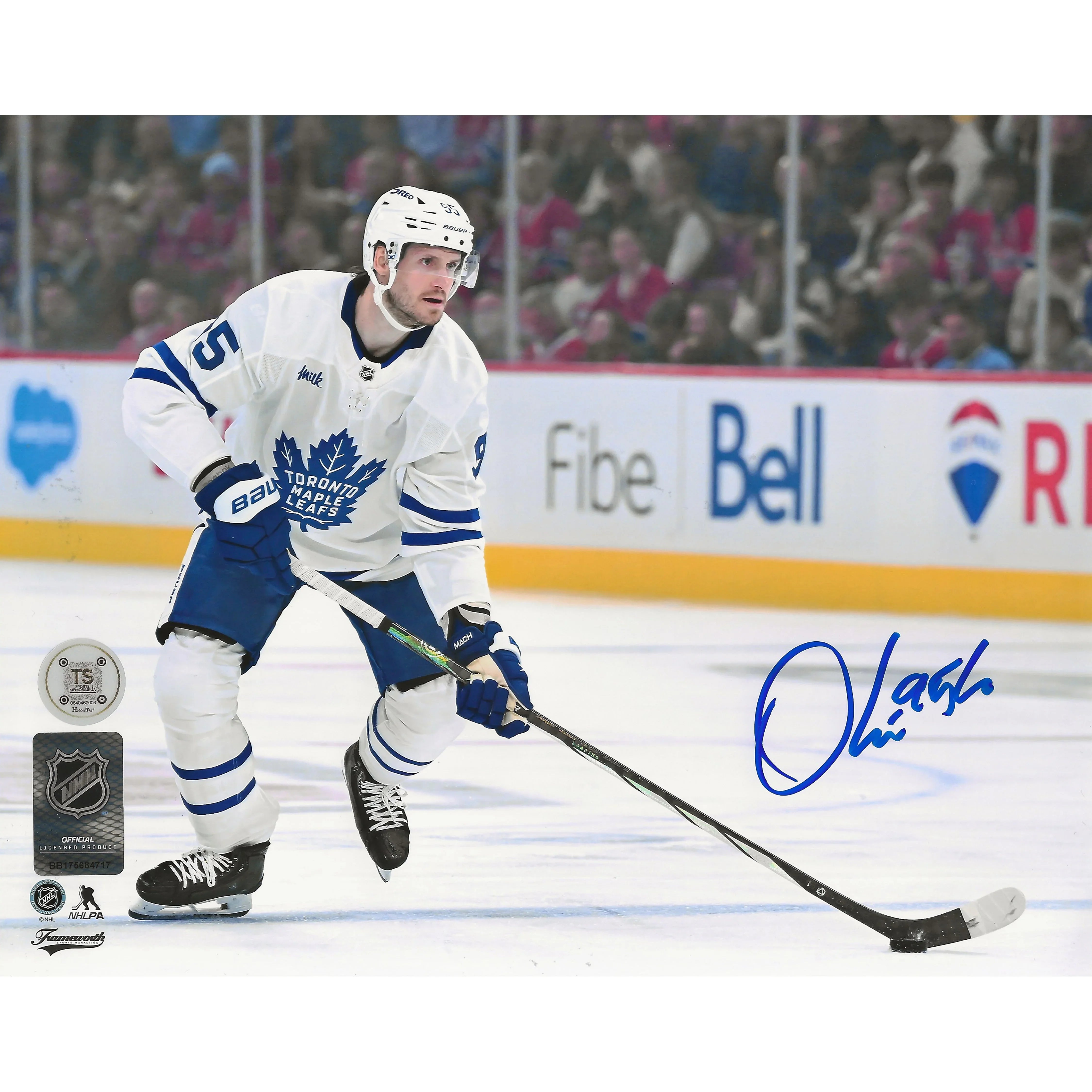 Toronto Maple Leafs player in white jersey playing hockey on ice, autograph visible