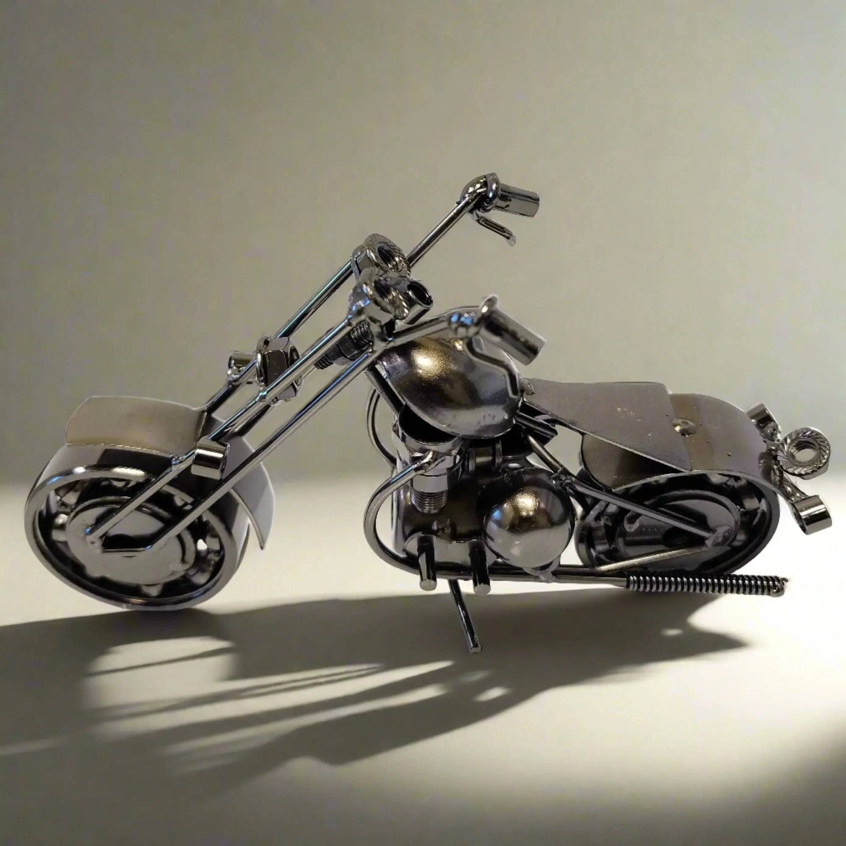 Metal motorcycle model gift on plain background, home decor collectible