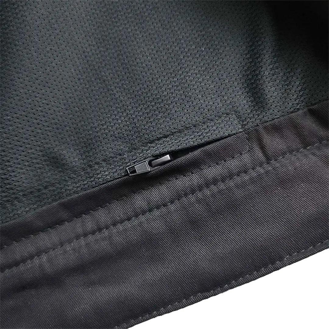 Close-up of black men's leather vest interior with mesh lining and hidden zipper pocket.