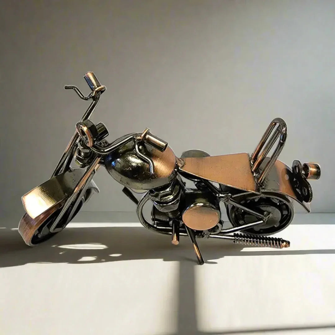 Metal small motorcycle model gift on white surface with soft lighting