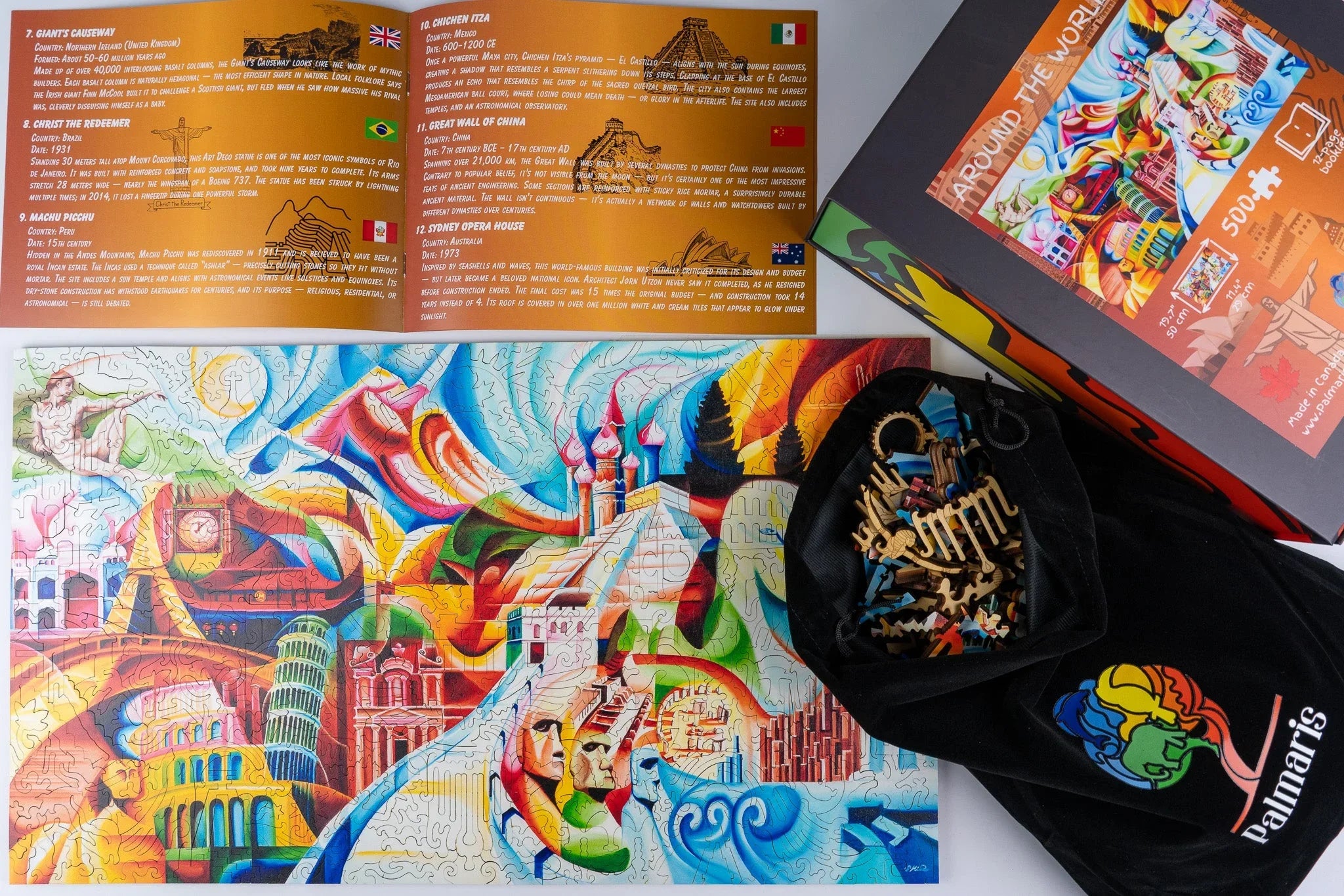 Colorful world landmarks puzzle completed, with guide, box, and wooden pieces bag visible