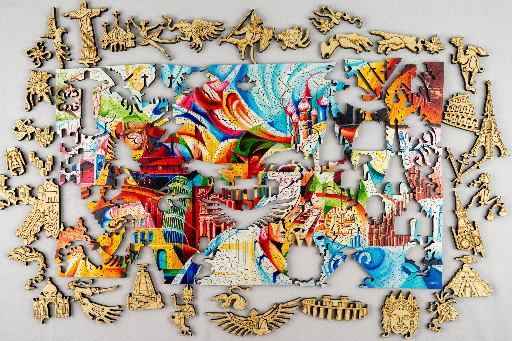 Colorful world landmarks jigsaw puzzle with unique shaped wooden pieces on a gray background