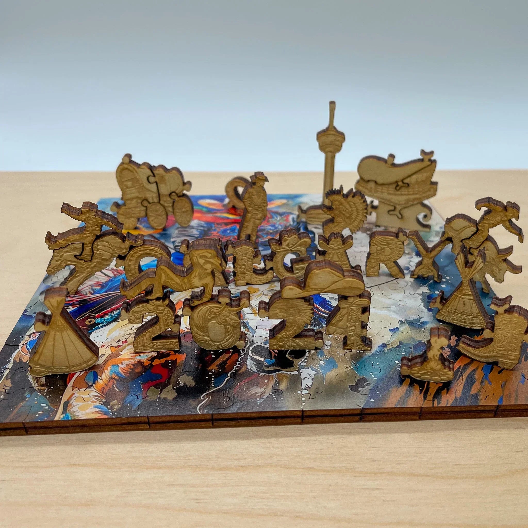 Wooden Calgary 2024 puzzle pieces featuring local icons and colorful base.