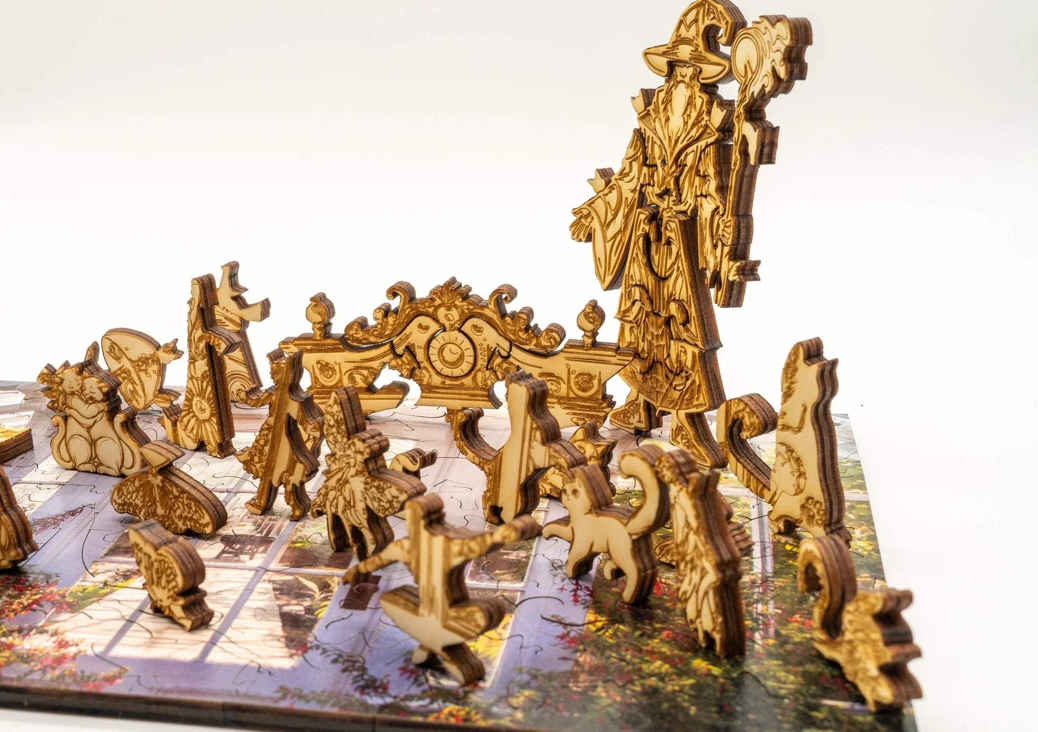 Wooden wizard puzzle pieces and fantasy animal figures on a decorative puzzle board
