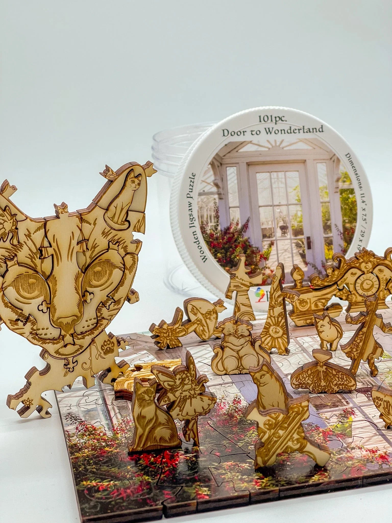 Door to Wonderland wooden jigsaw puzzle with whimsical animal-shaped pieces