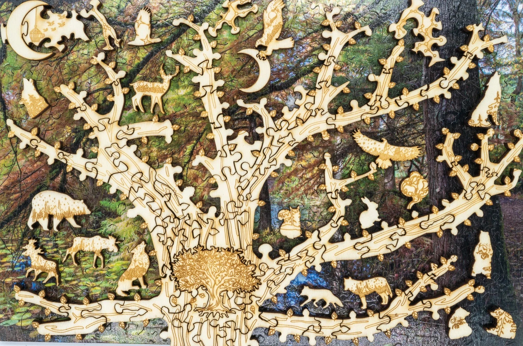 Wooden animal tree puzzle on forest background, featuring bears, wolves, owls, and deer shapes