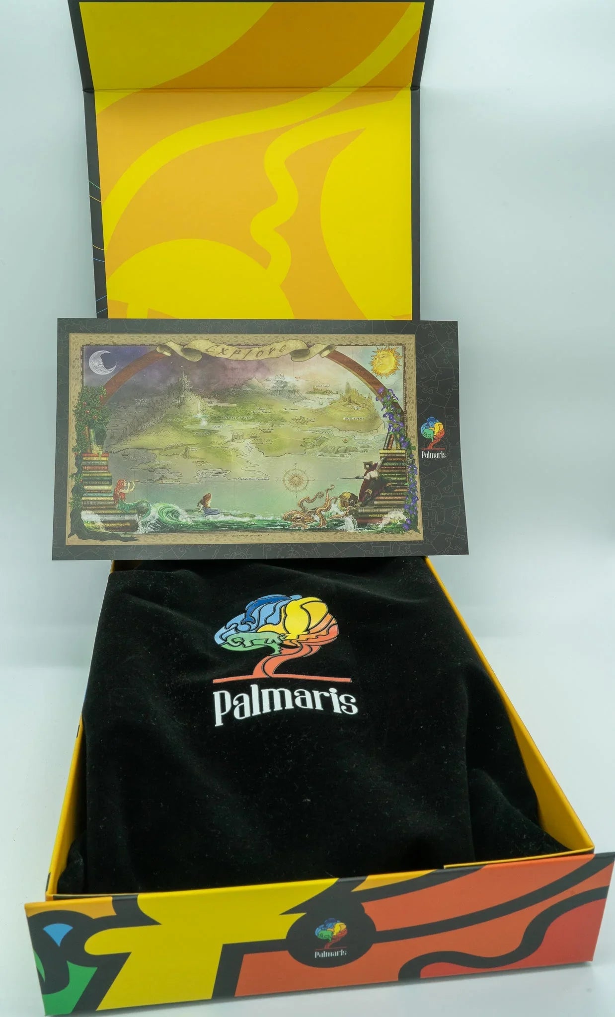 Colorful Palmaris gift box with black velvet interior and fantasy map card insert