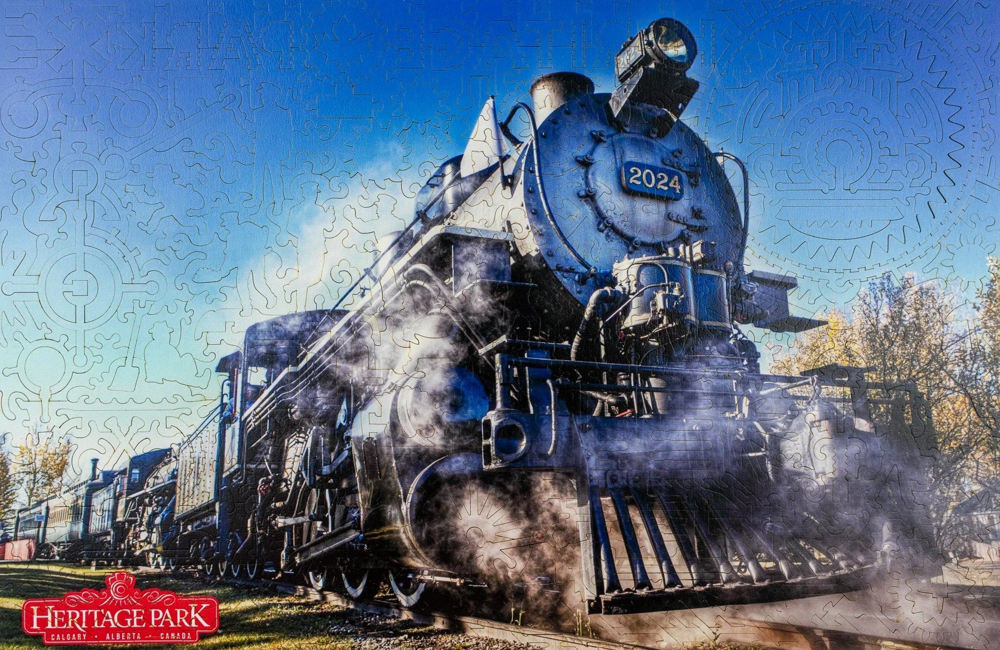 Steam locomotive 2024 at Heritage Park Calgary Alberta, emitting steam on railroad track