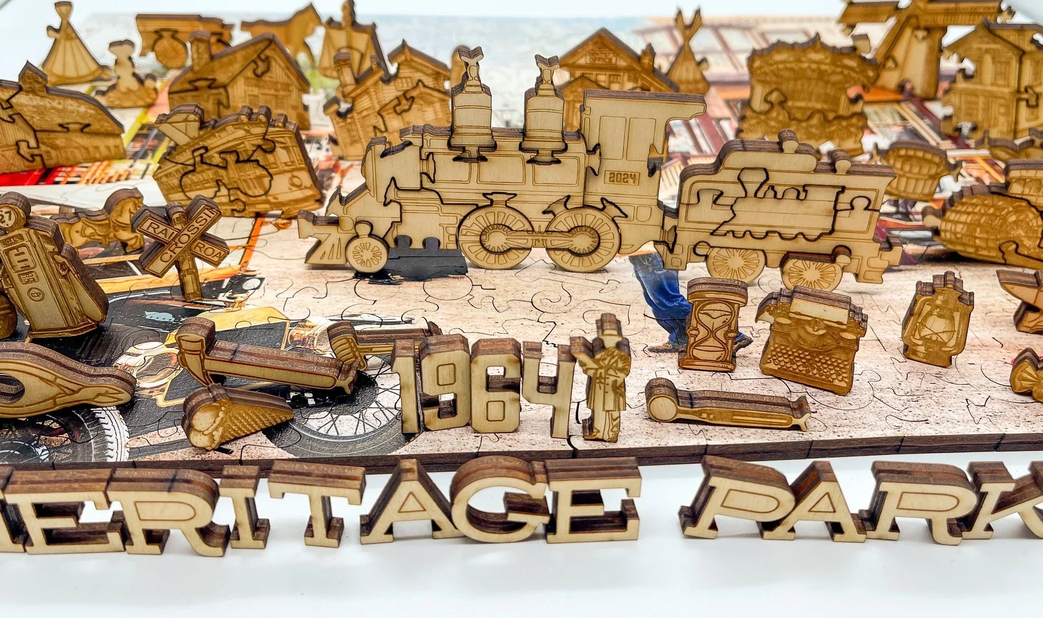 Wooden puzzle featuring a train, vintage objects, and 'HERITAGE PARK 1964' text.