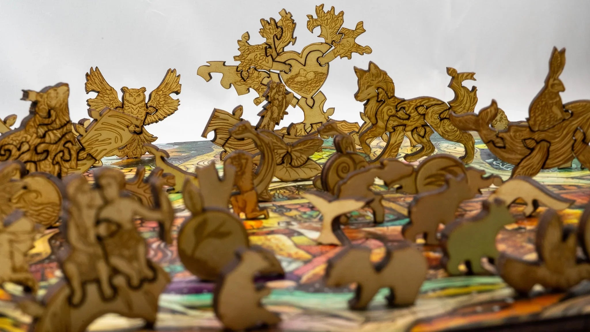 Laser-cut wooden animal puzzle pieces on a colorful background, intricate jigsaw design