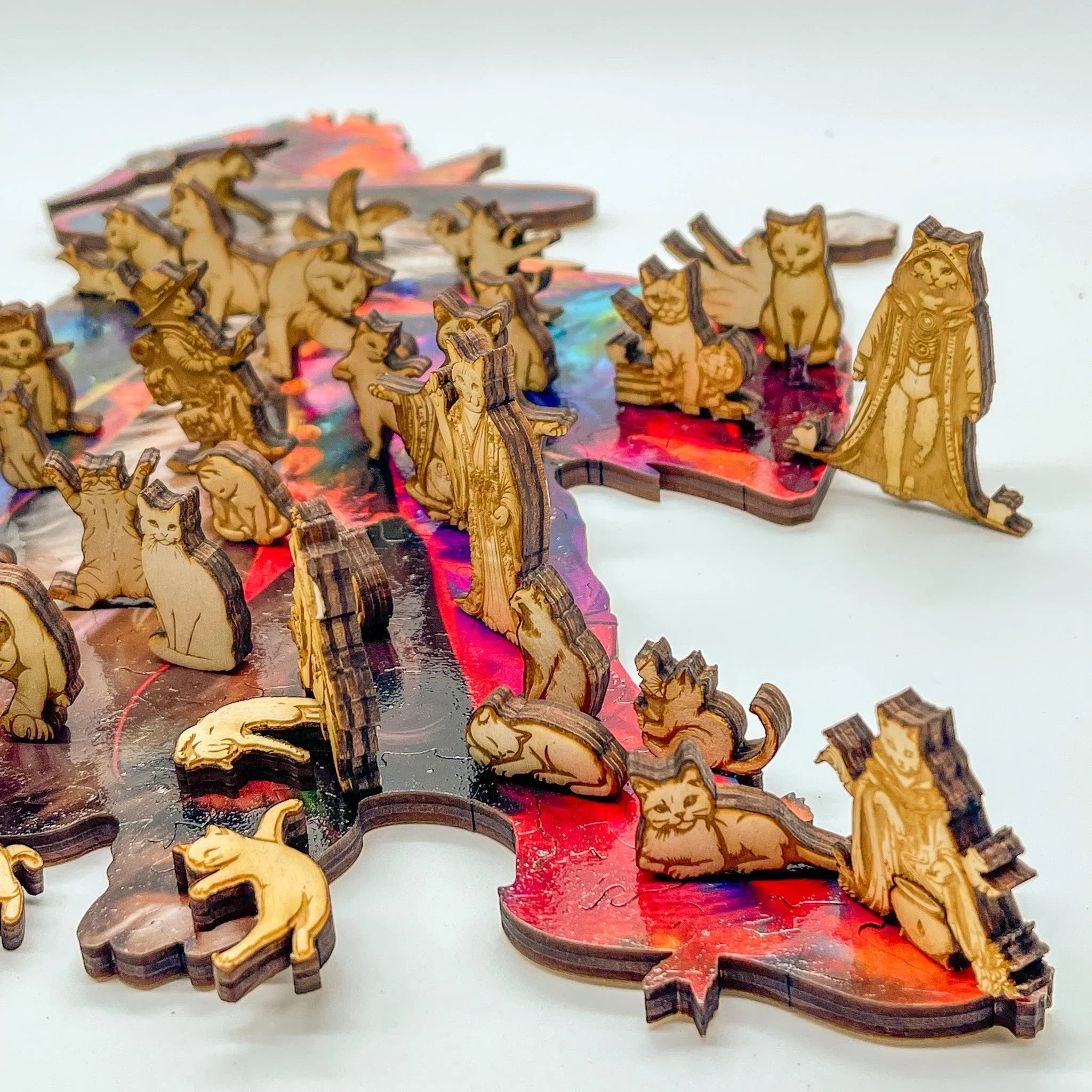 Wooden cat puzzle pieces on colorful jigsaw puzzle base, feline shaped brain teaser gift.