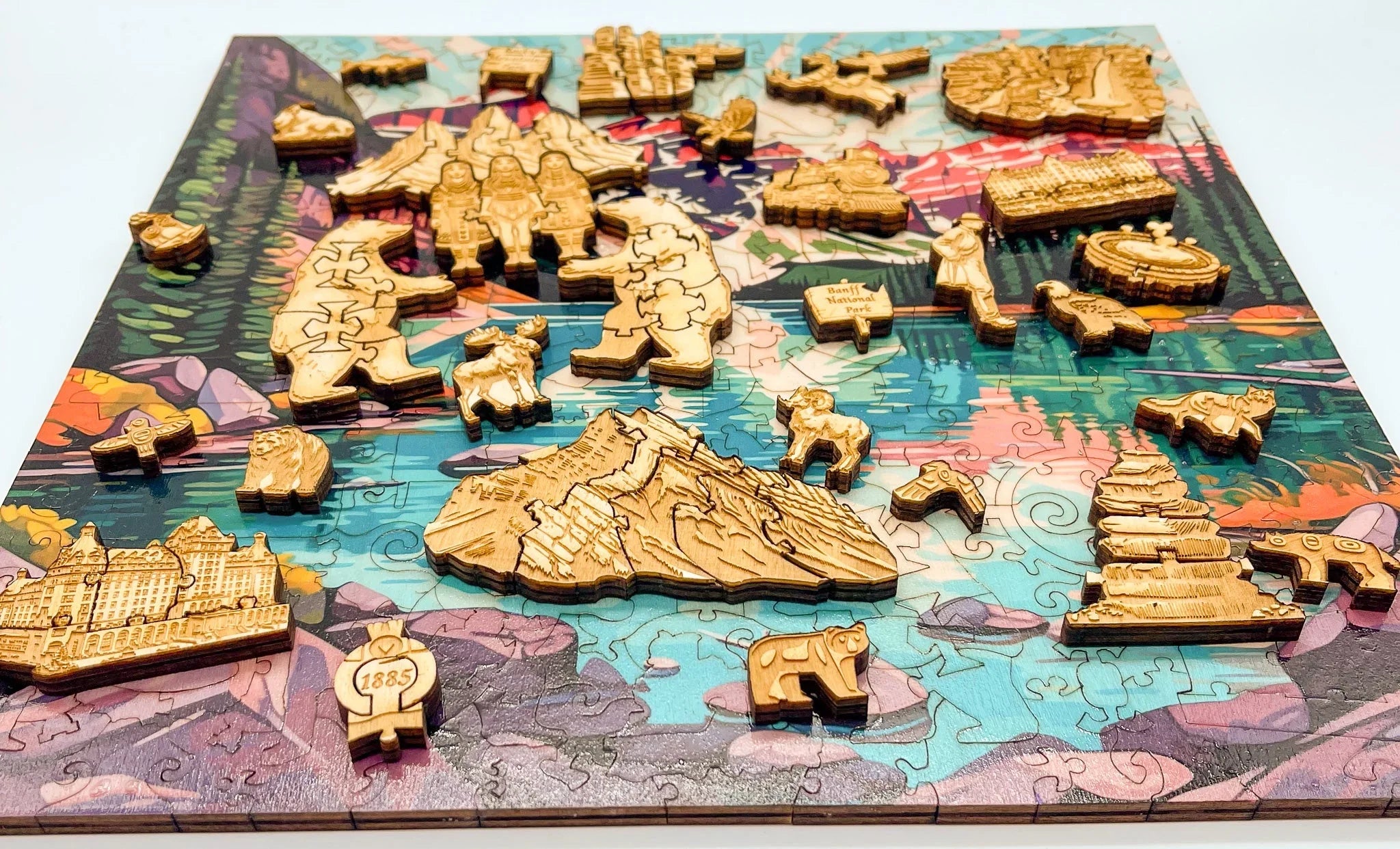 Wooden Banff National Park jigsaw puzzle with engraved figures and colorful landscape background