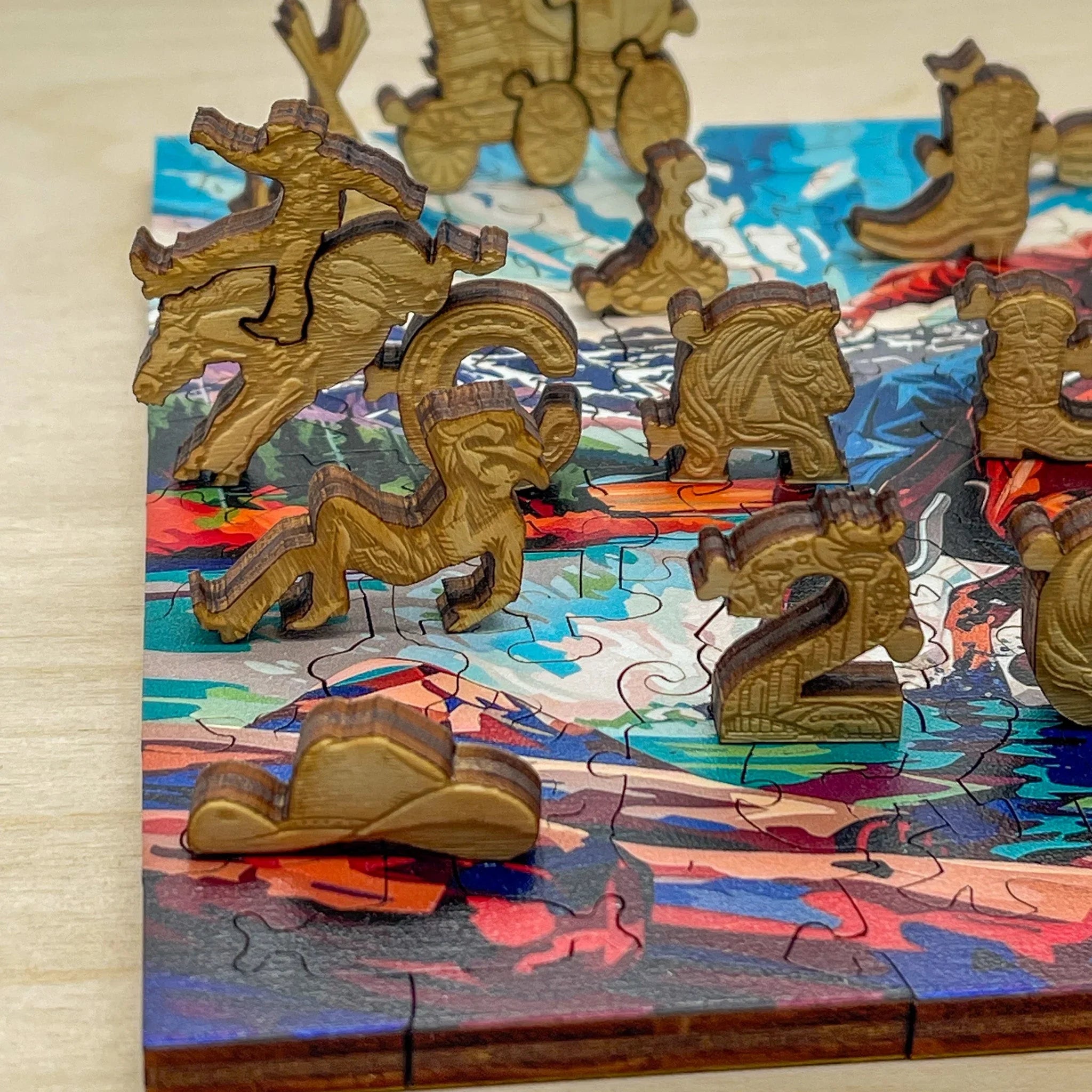 Wooden animal and number puzzle pieces on colorful jigsaw puzzle background