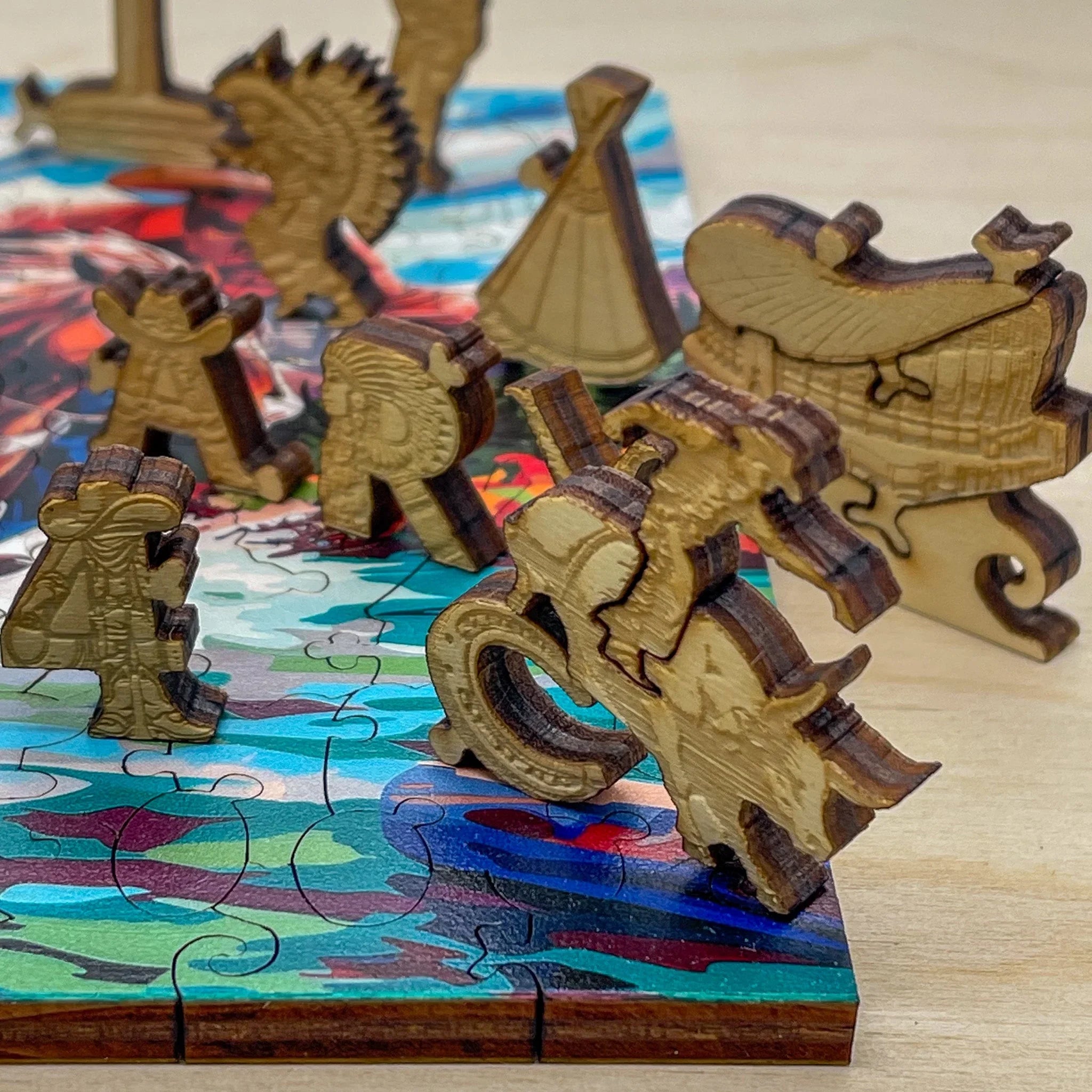 Wooden animal-shaped puzzle pieces on a colorful jigsaw puzzle board