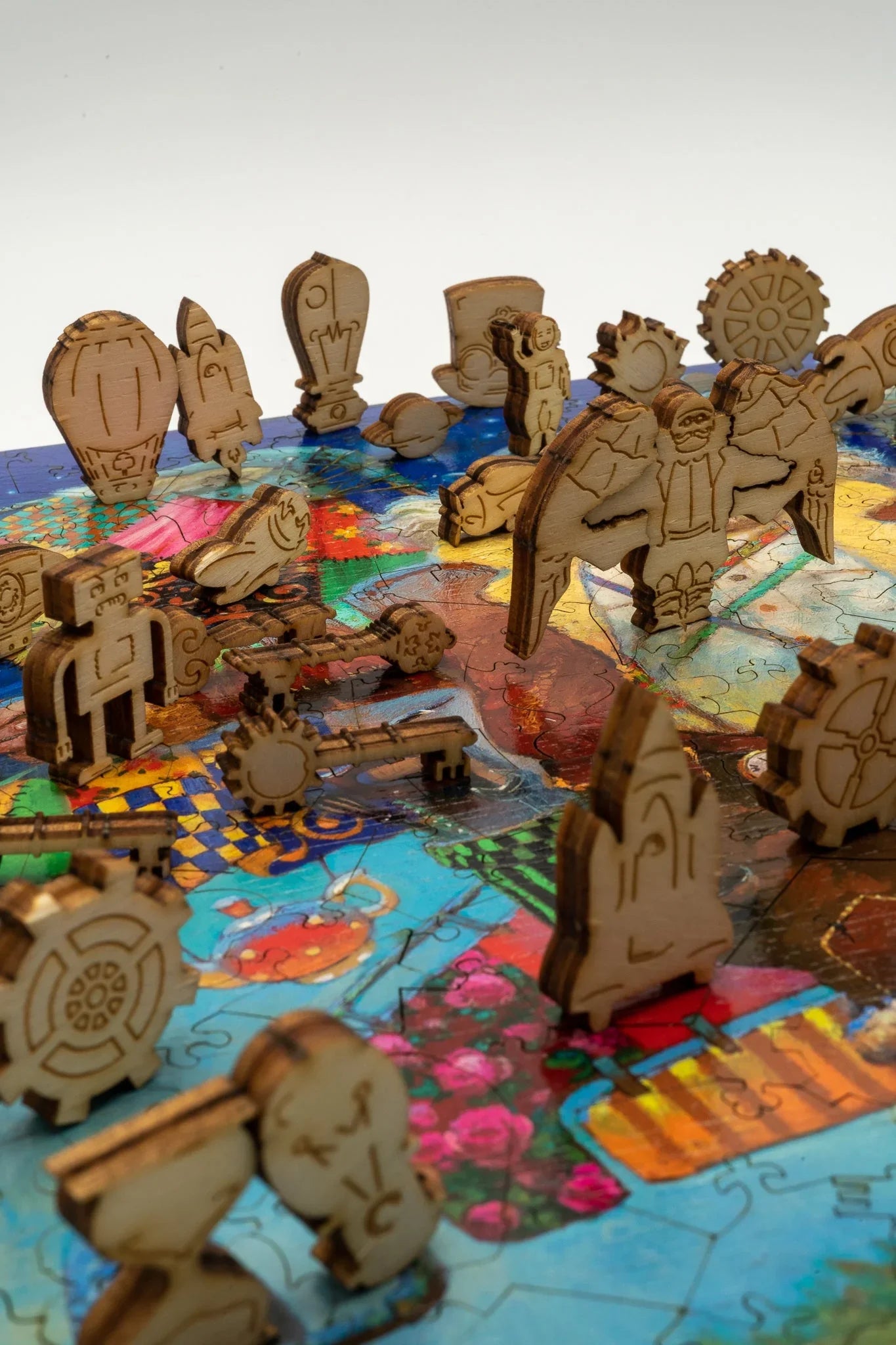 Wooden steampunk puzzle pieces on a colorful jigsaw puzzle board