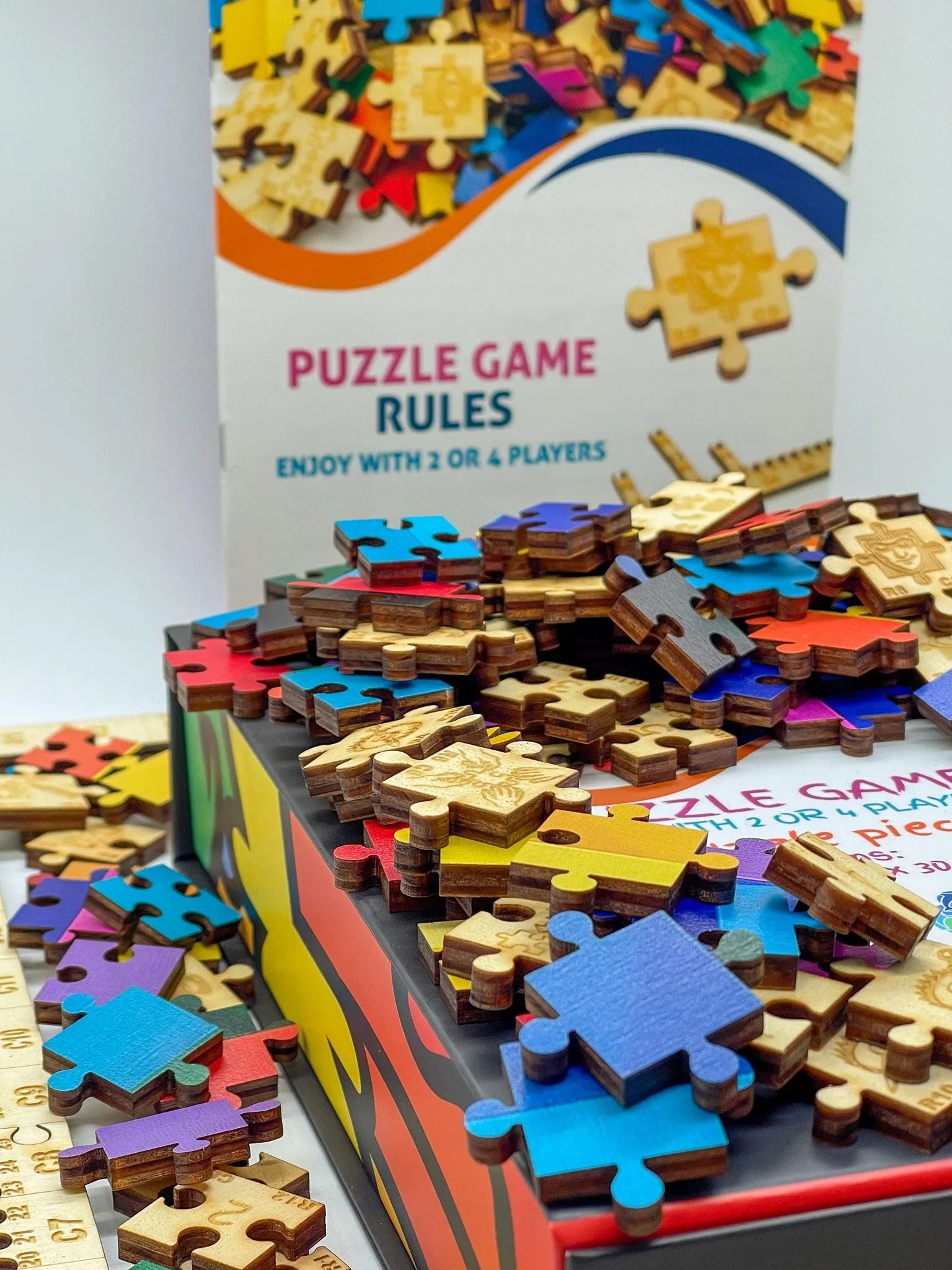 Colorful wooden puzzle pieces on a game box with puzzle rules in the background
