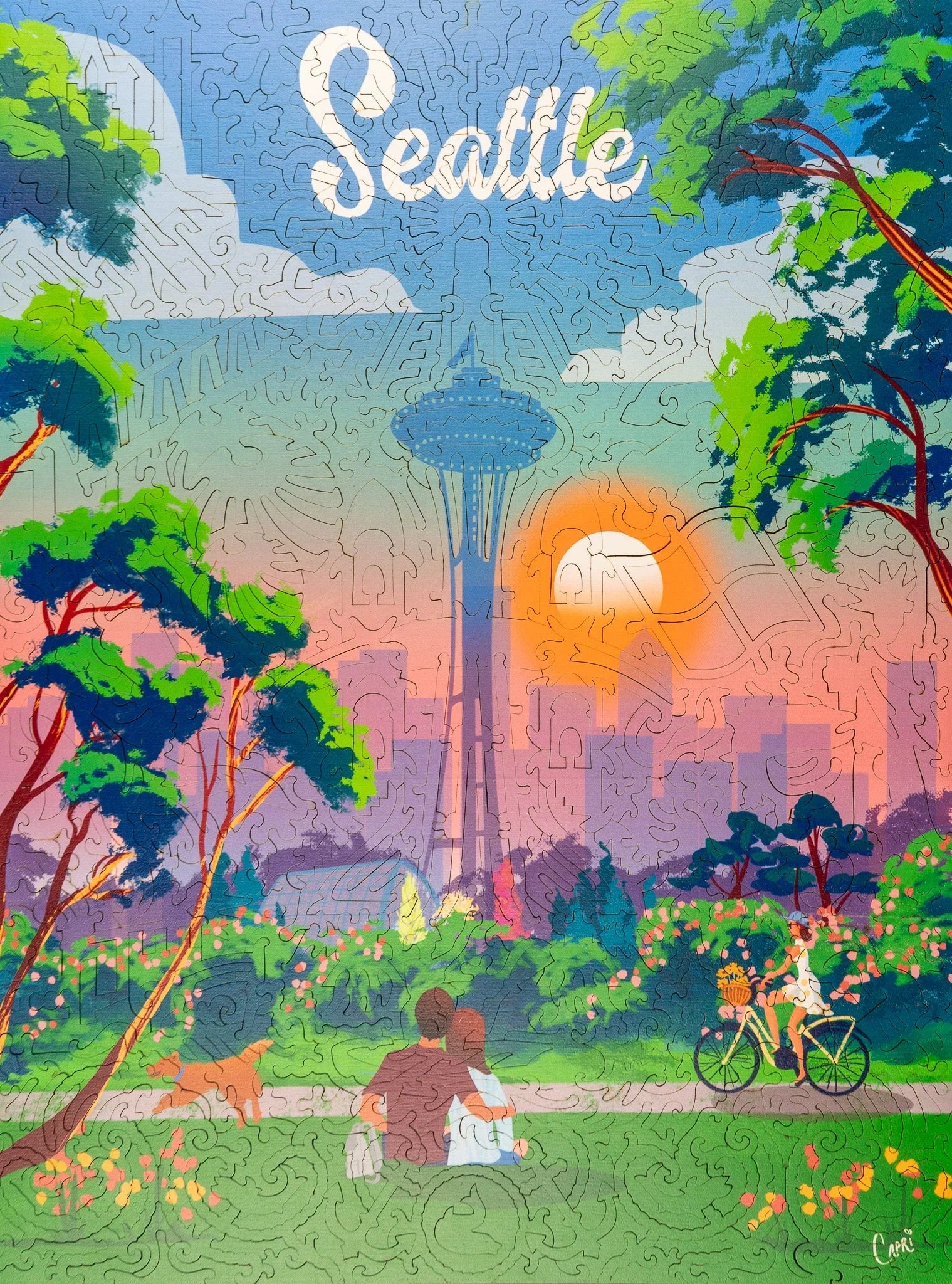 Seattle landscape puzzle with Space Needle, sunset, park, couple, biker, dog, and flowers.