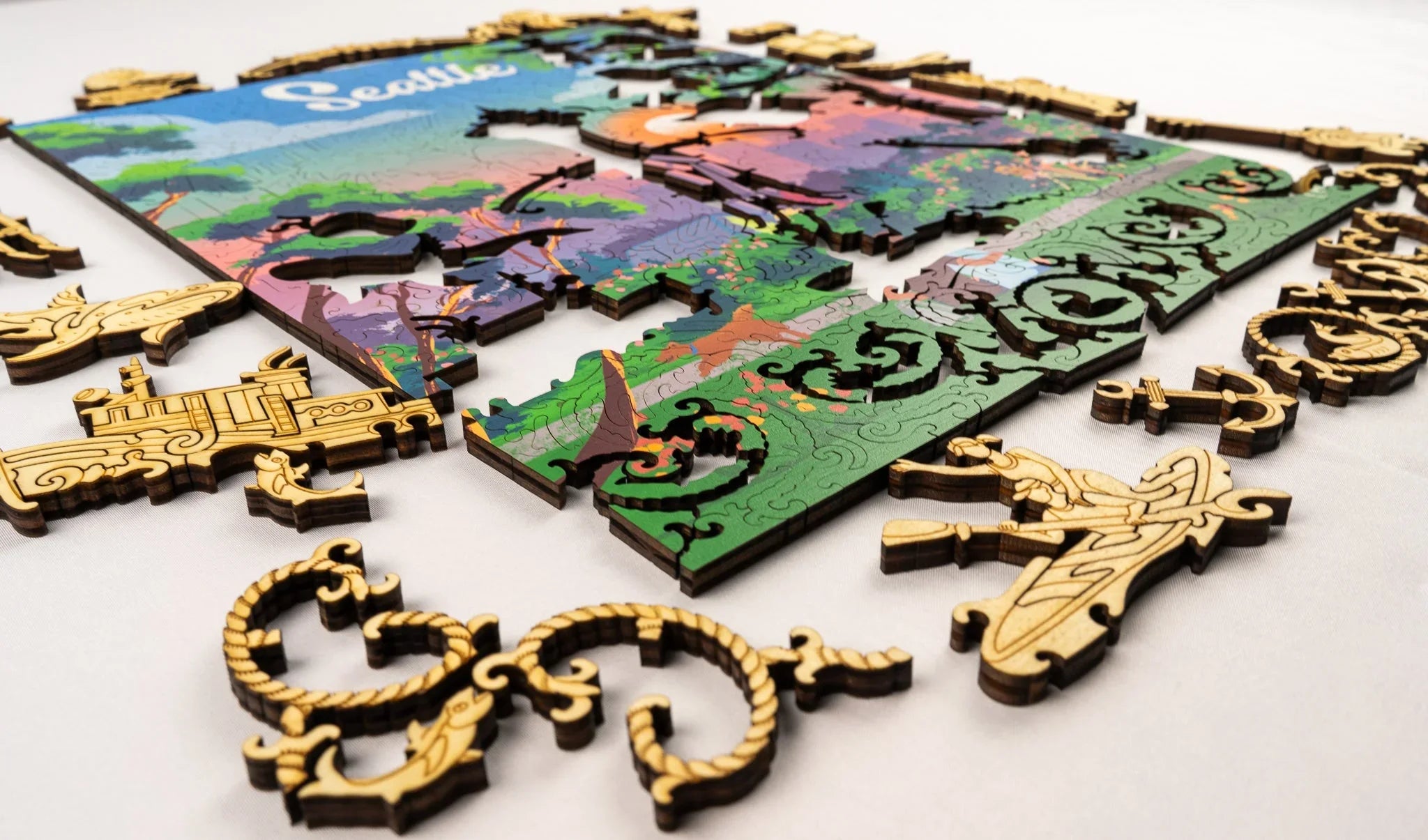 Colorful Seattle wooden puzzle with unique shaped pieces on a white surface