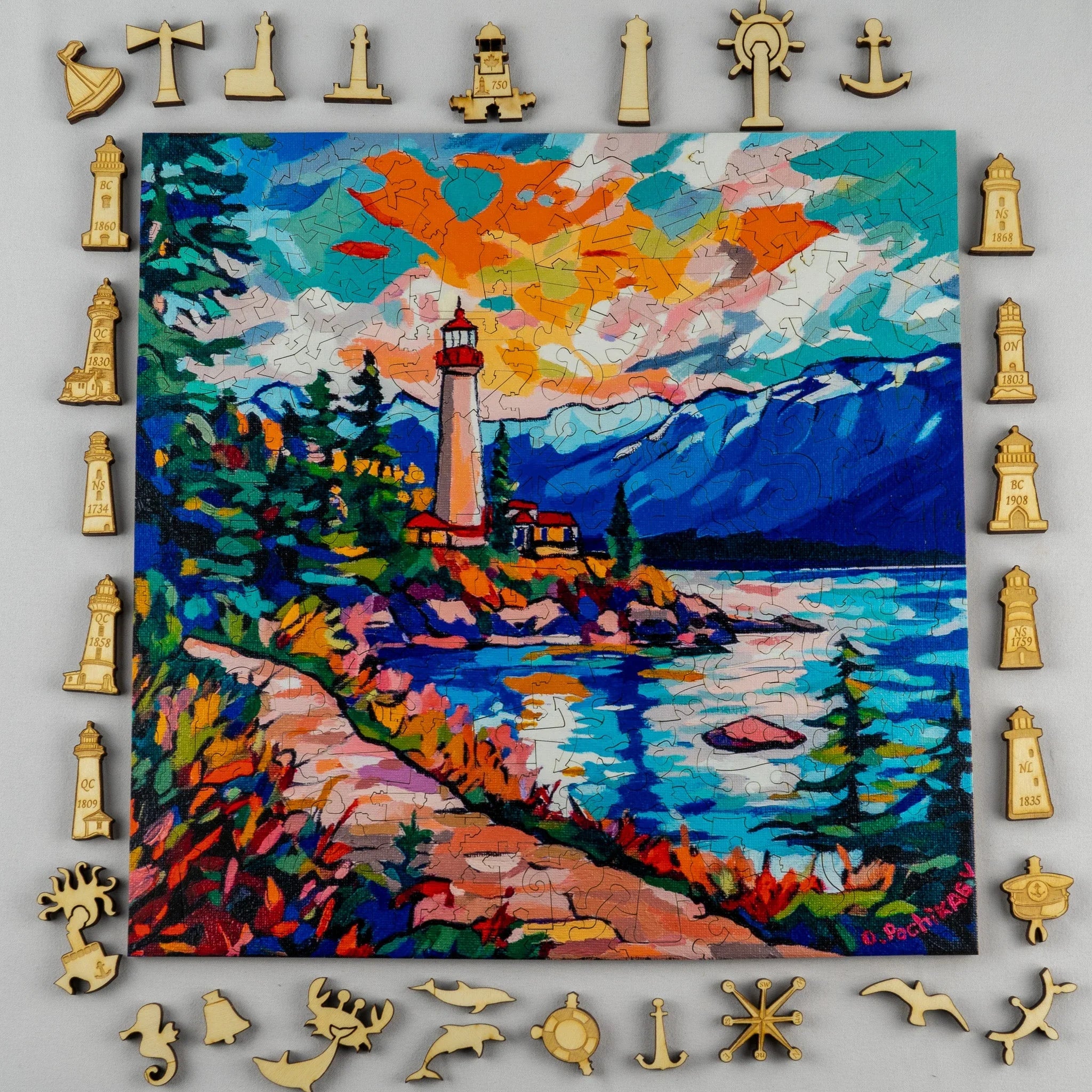 Colorful lighthouse puzzle with wooden lighthouse and nautical shaped pieces around the border