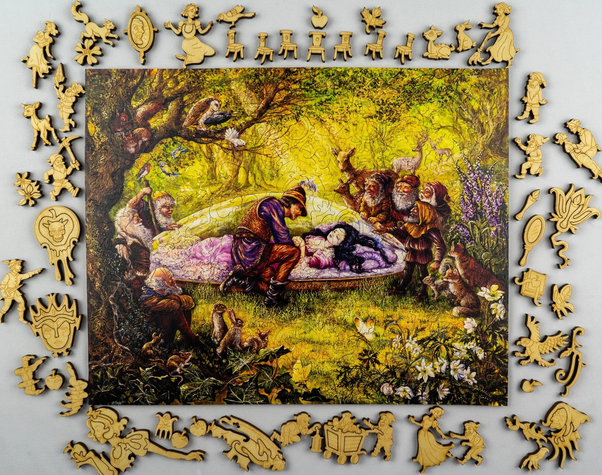 Snow White fairy tale wooden puzzle, surrounded by whimsical character pieces