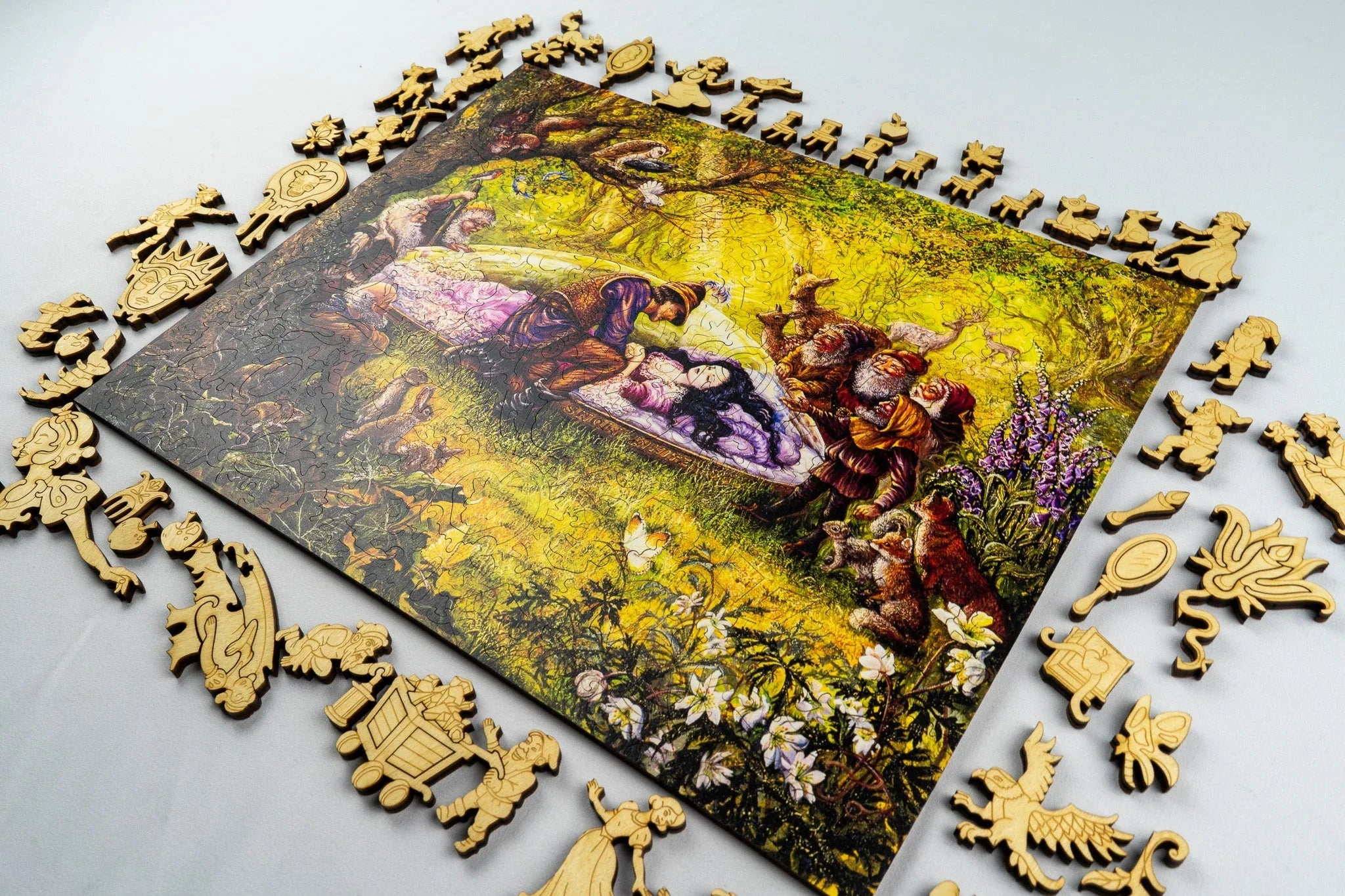 Intricate Sleeping Beauty wooden jigsaw puzzle with fairy tale shaped pieces on a light surface