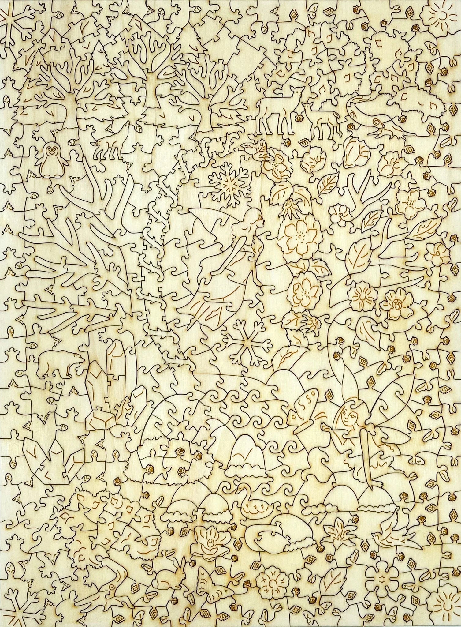 Wooden jigsaw puzzle featuring engraved fairies, animals, snowflakes, and trees in a forest design