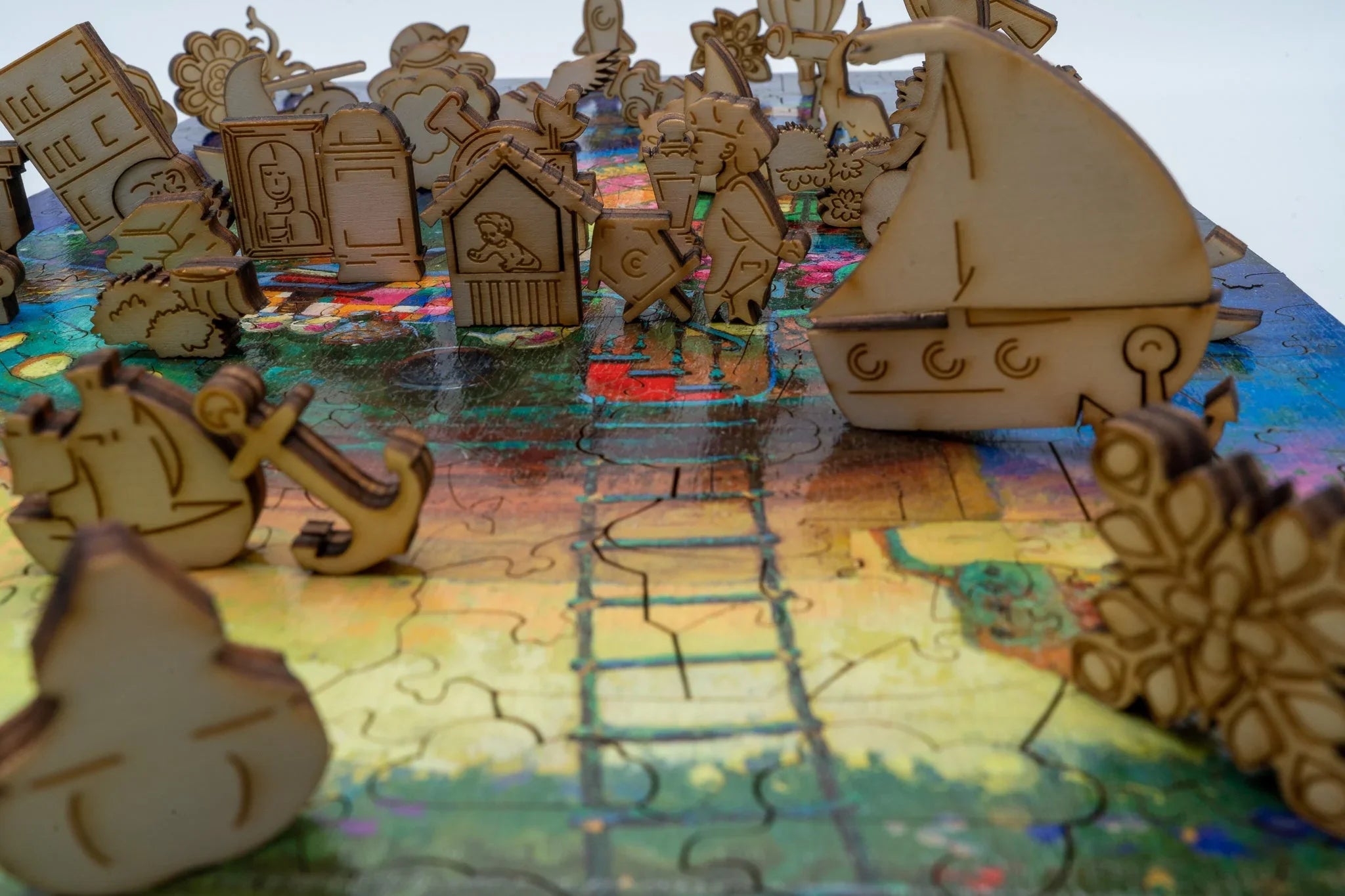 Wooden puzzle game with colorful base and quirky 3D laser-cut animal and boat pieces