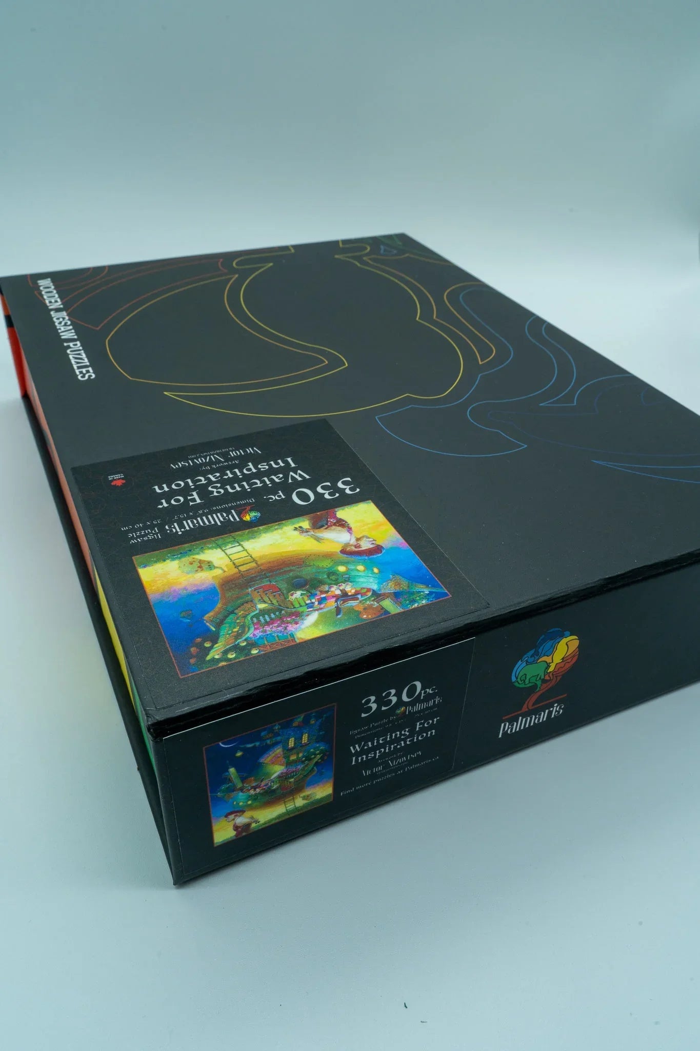 Palmart's 330 piece Waiting For Inspiration wooden jigsaw puzzle box on light background