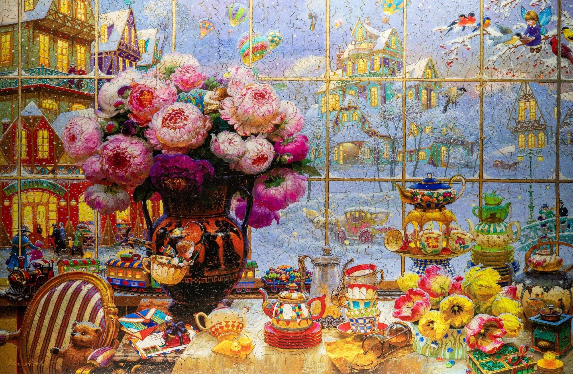 Festive tea party with colorful teacups, flowers, and winter town scene outside window