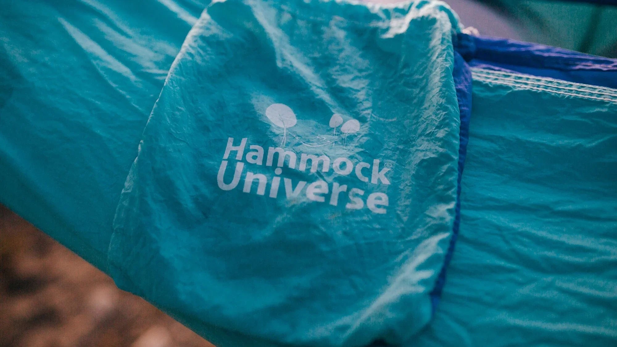 Hammock Universe blue nylon hammock with logo outdoors